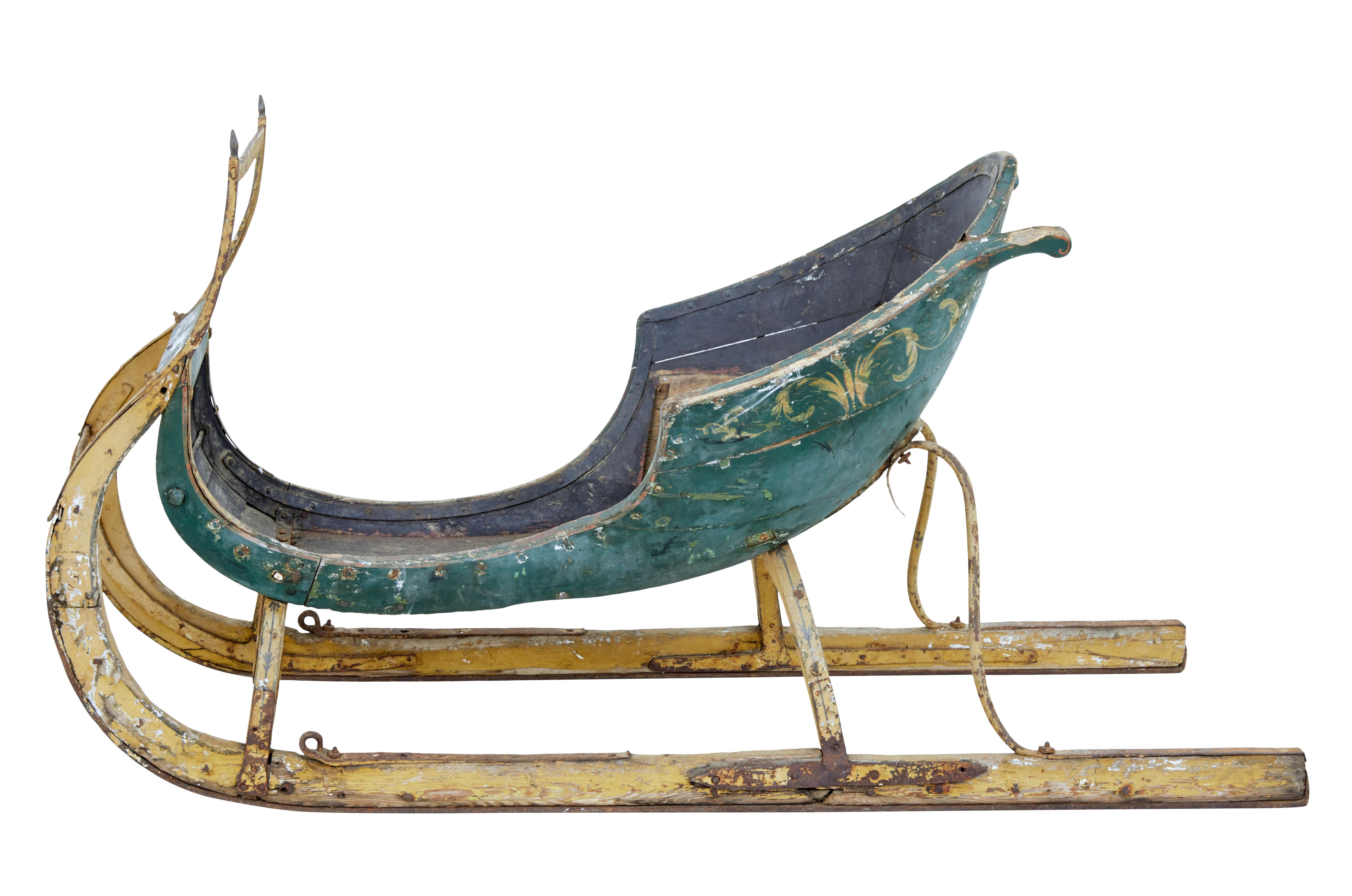 18th century hand painted Scandinavian sleigh, circa 1764.

We are pleased to offer this fine piece of Scandinavian hand painted Folk Art. Decorated in a green and yellow scheme. Elegant shape to allow this sled to be pulled by a team of