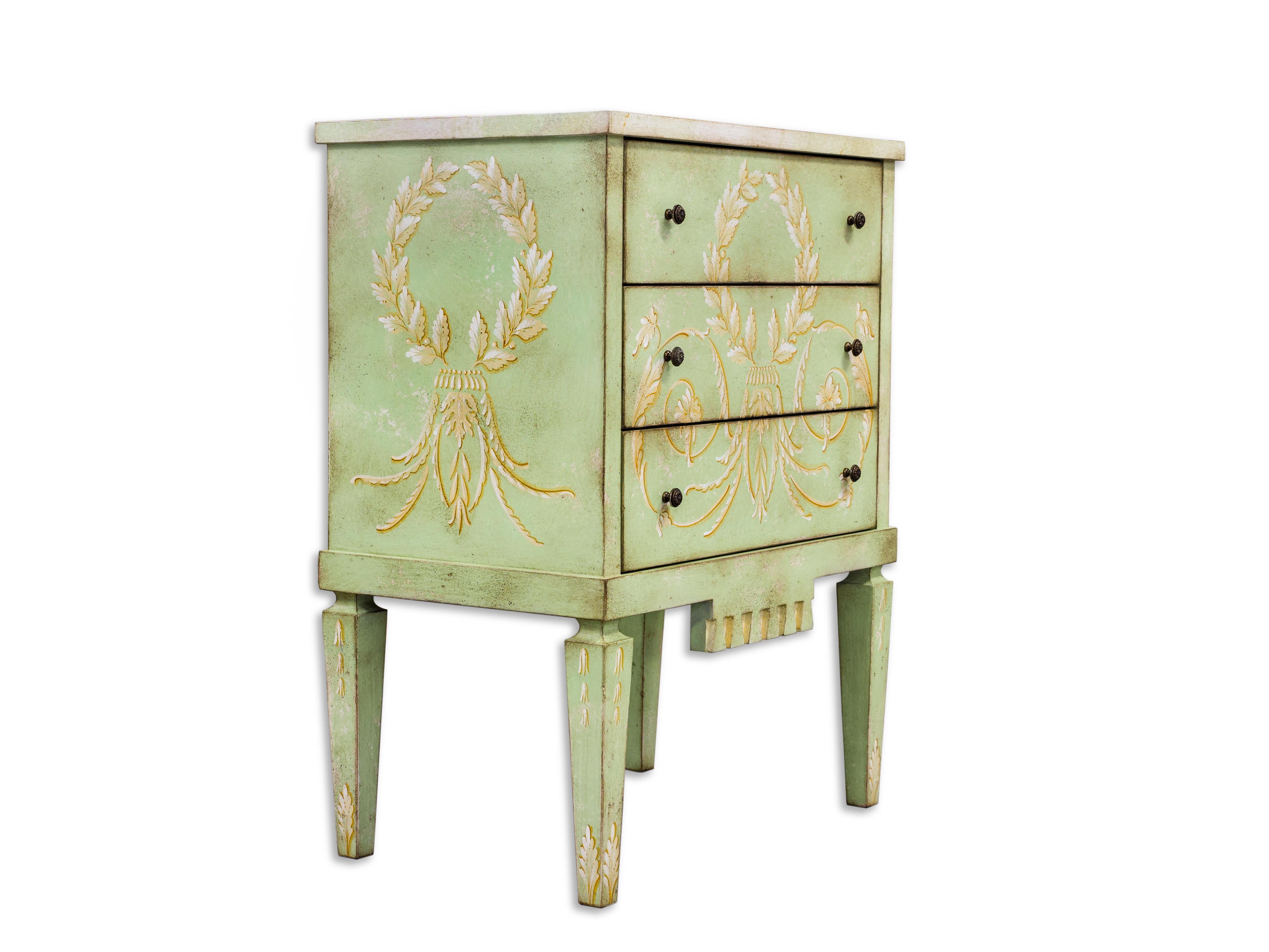 From our Hand-Painted Furniture Collection, we are pleased to introduce you to our La Fenice Nightstand with drawers. 
In a lively Apple Green color with reinassance inspired decor in ochre, this beautiful nightstand will bring along the historical