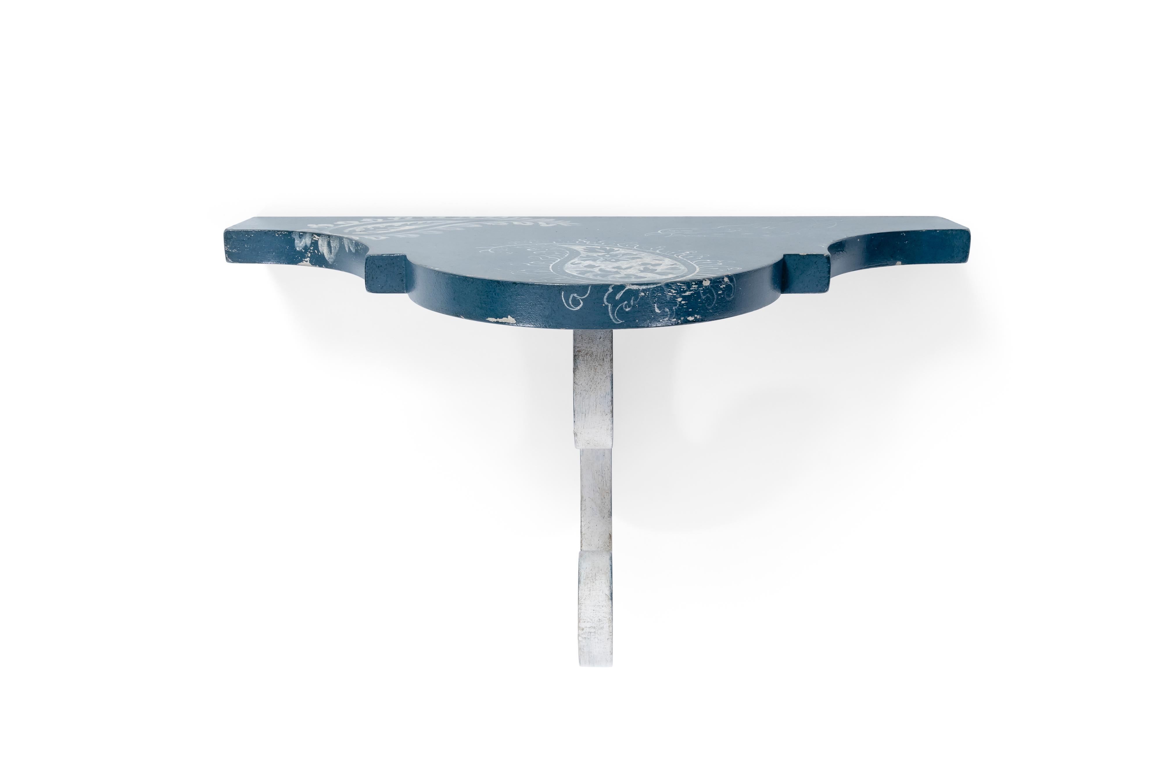 From our hand-painted Furniture Collection, we are pleased to introduce you to our Santa Croce Shelf.
Finished in an elegant deep sea blue with sweet monochromatic decors, this beautiful shelf will surely add that touch of sweet whimsy to any room