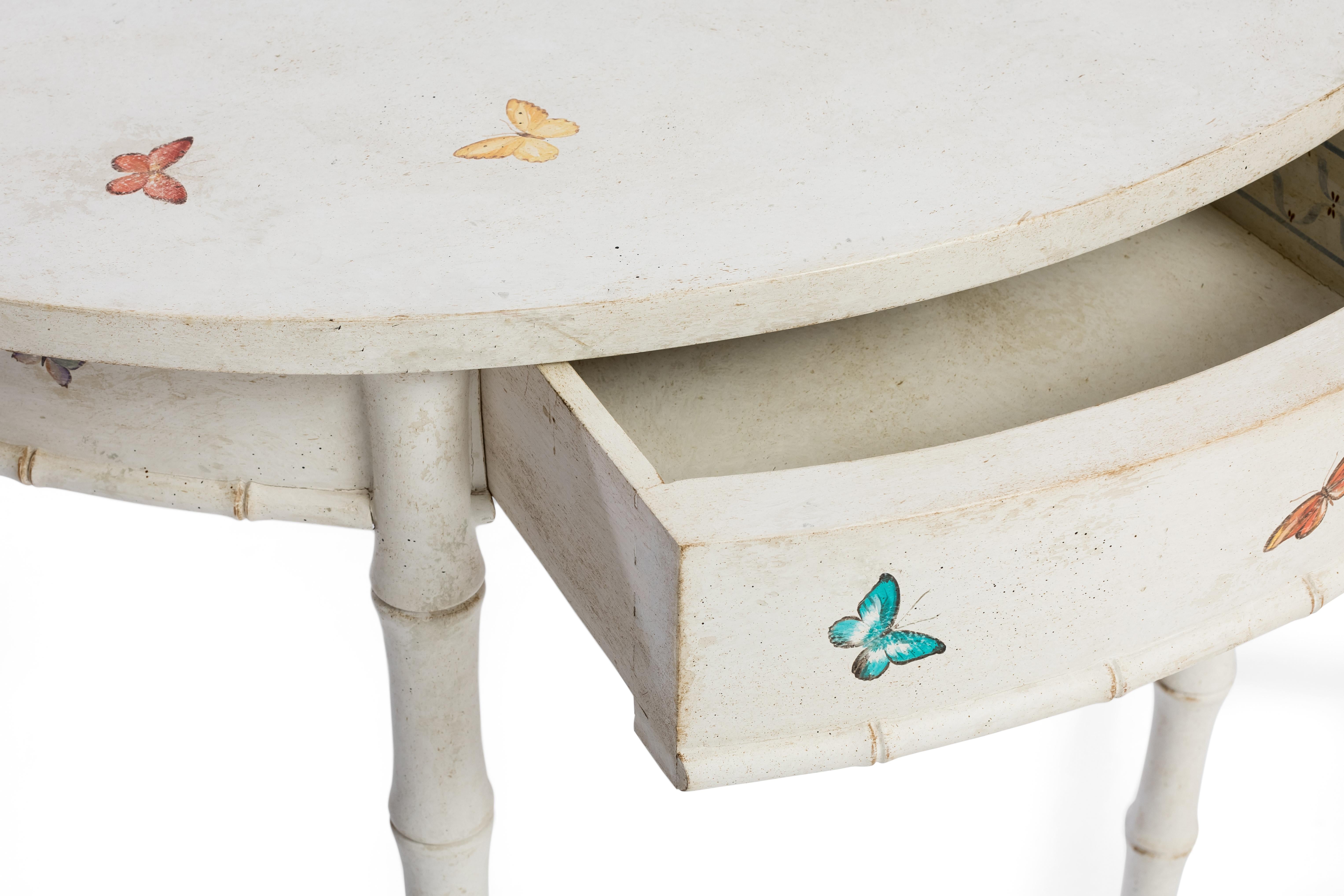 From our hand-painted Furniture Collection, we are pleased to introduce you to our bamboo Ravenna Demilune. 
Finished in a timeless chalky white with sweet butterflies decors, this eclectic demilune will surely add that touch of sweet whimsy to any
