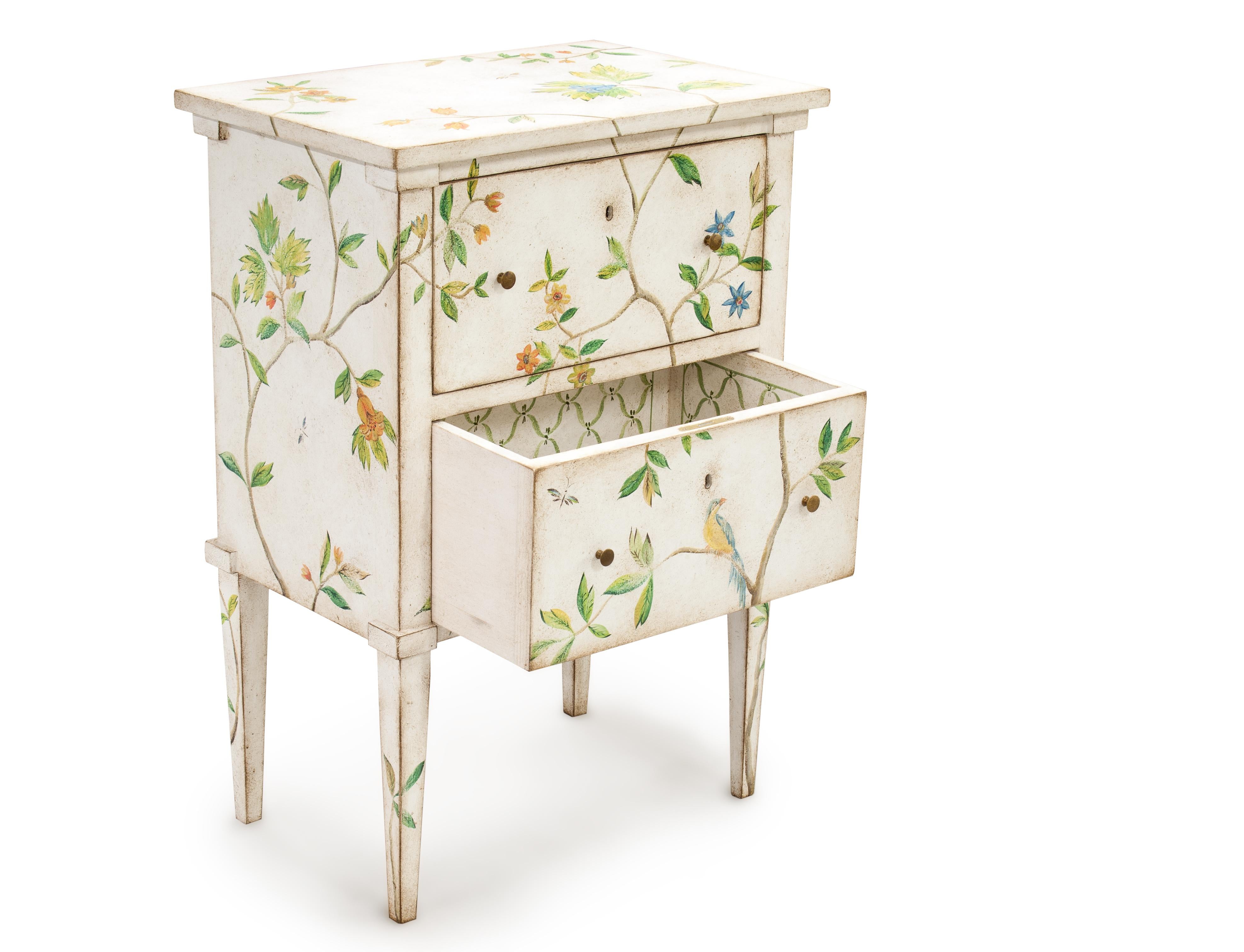 From our Hand-Painted Furniture Collection, we are pleased to introduce you to our Lombardia Nightstand.
Timeless frame with solid, contemporary lines rivisited with our whimsical foliage decor with blooming flowers and perched birds, all in a sweet