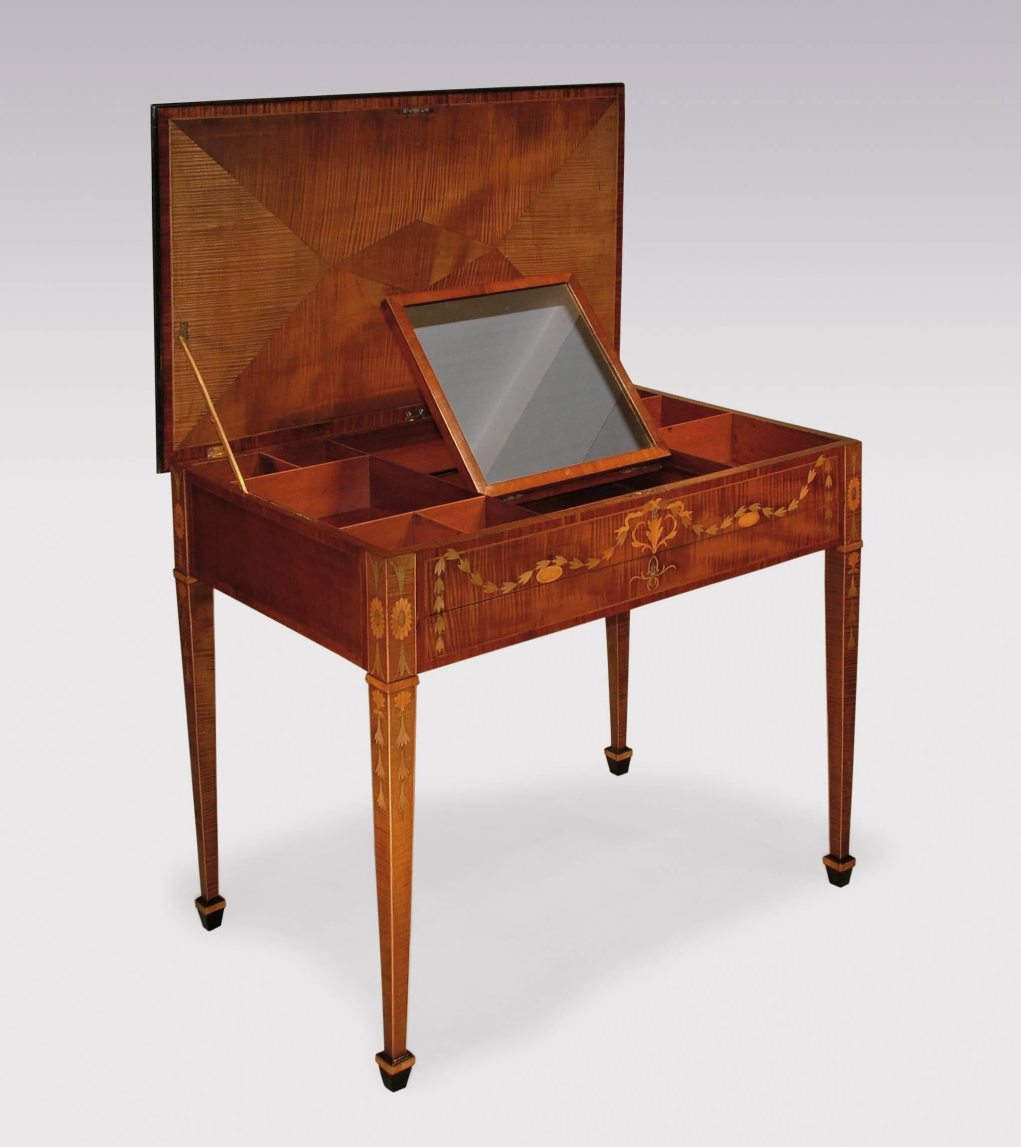 A fine and rare late 18th century harewood dressing table, after designs by Mayhew and Ince, boxwood and ebony strung throughout, having crossbanded mitred top with pen work leaf bordered central padouk wood oval panel and fan inlay to the corners.