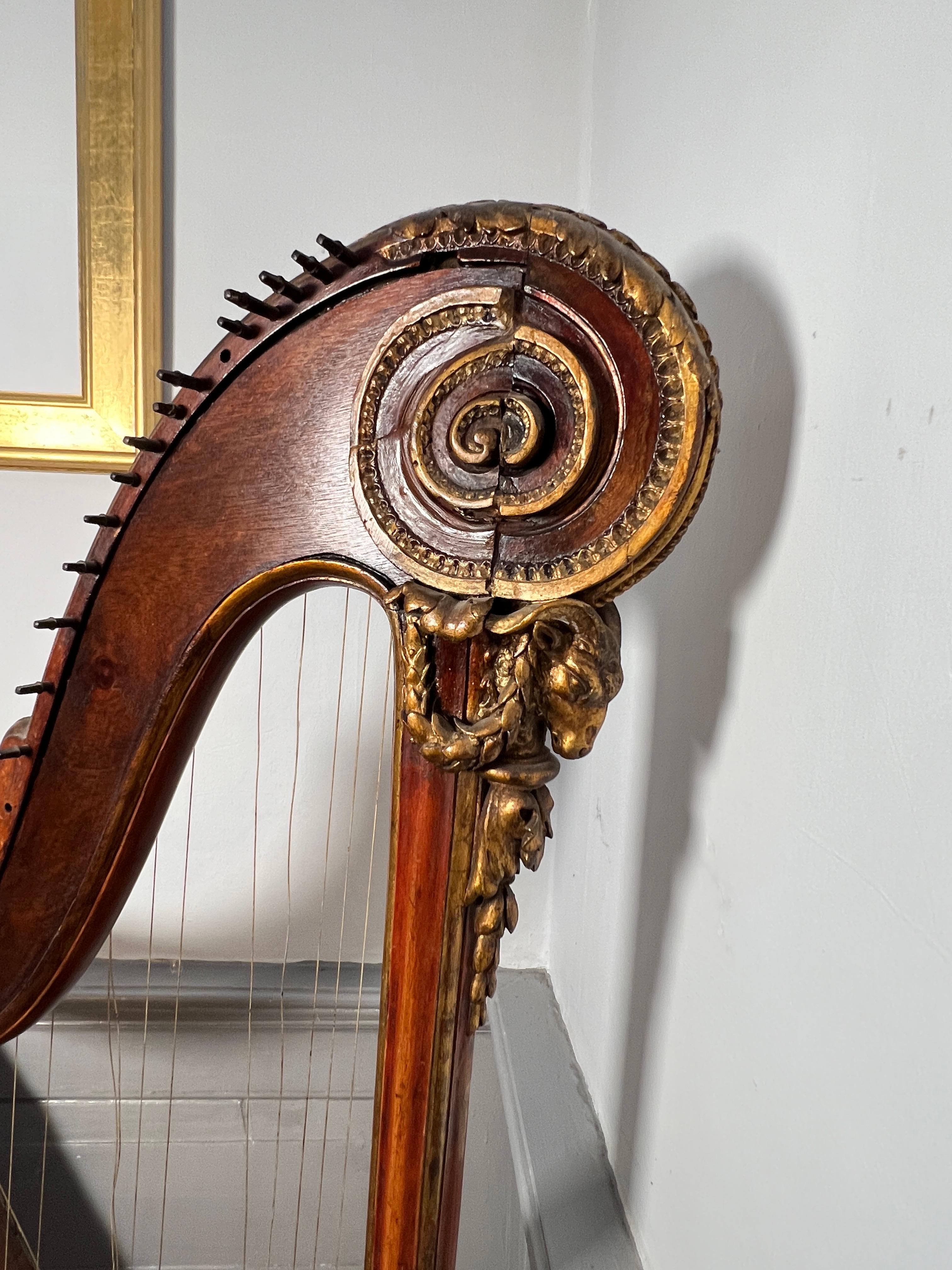 This is a completely unrestored but extremely original example of of a 18th century harp by Cousineau pere et fils.
Cousineau improved the harp’s pedal mechanism which shortens the playing length of the strings and makes it possible to play