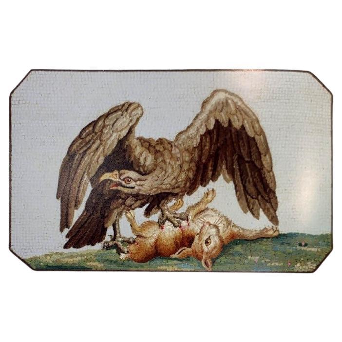 18th Century Hunting Eagle Micro Mosaic Plaque

A micro mosaic set in silver depicting an eagle grasping a rabbit. The design is a recreation of a part of the title page of 