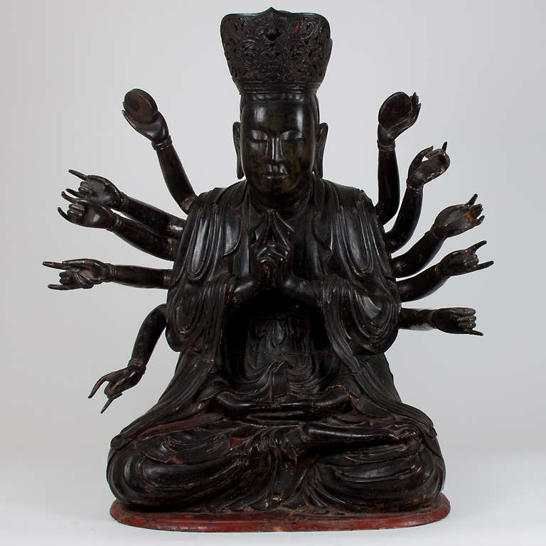Large Wooden Buddha with 14 arms, Vietnam, 18th century.  Included documentation, provenance Quan'am, the God of compassion lacquered with rests of old black and red polychromes.  Very good and original condition.  Few age marks, some minor breaks,