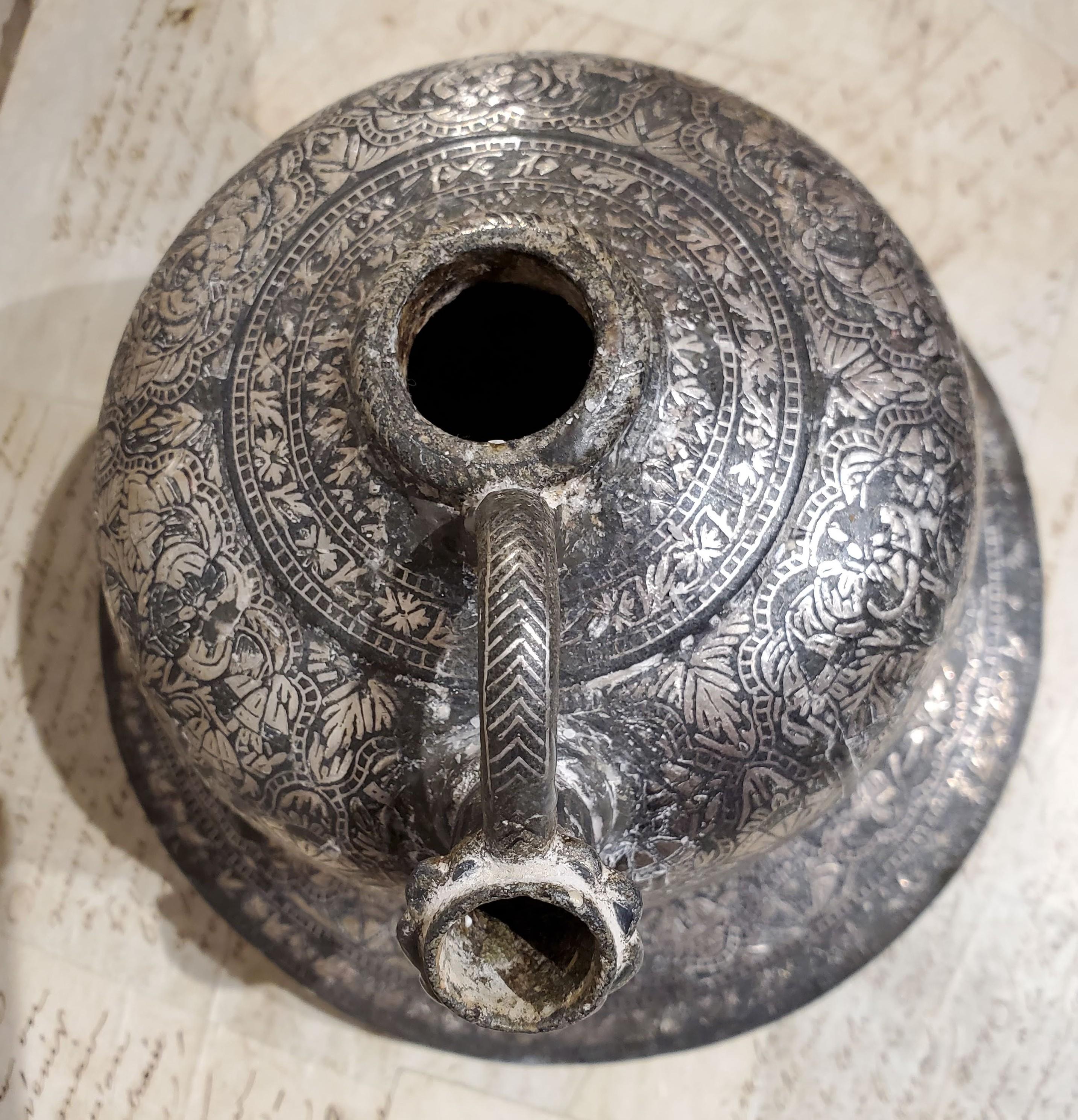 This 18th century Indian ”Bidriware” hookah base is beautifully intricate. Makes a statement on its own or modernize it and use as a candleholder. Bidri is a metal working technique unique to India, which involves inlaying fine geometric and floral