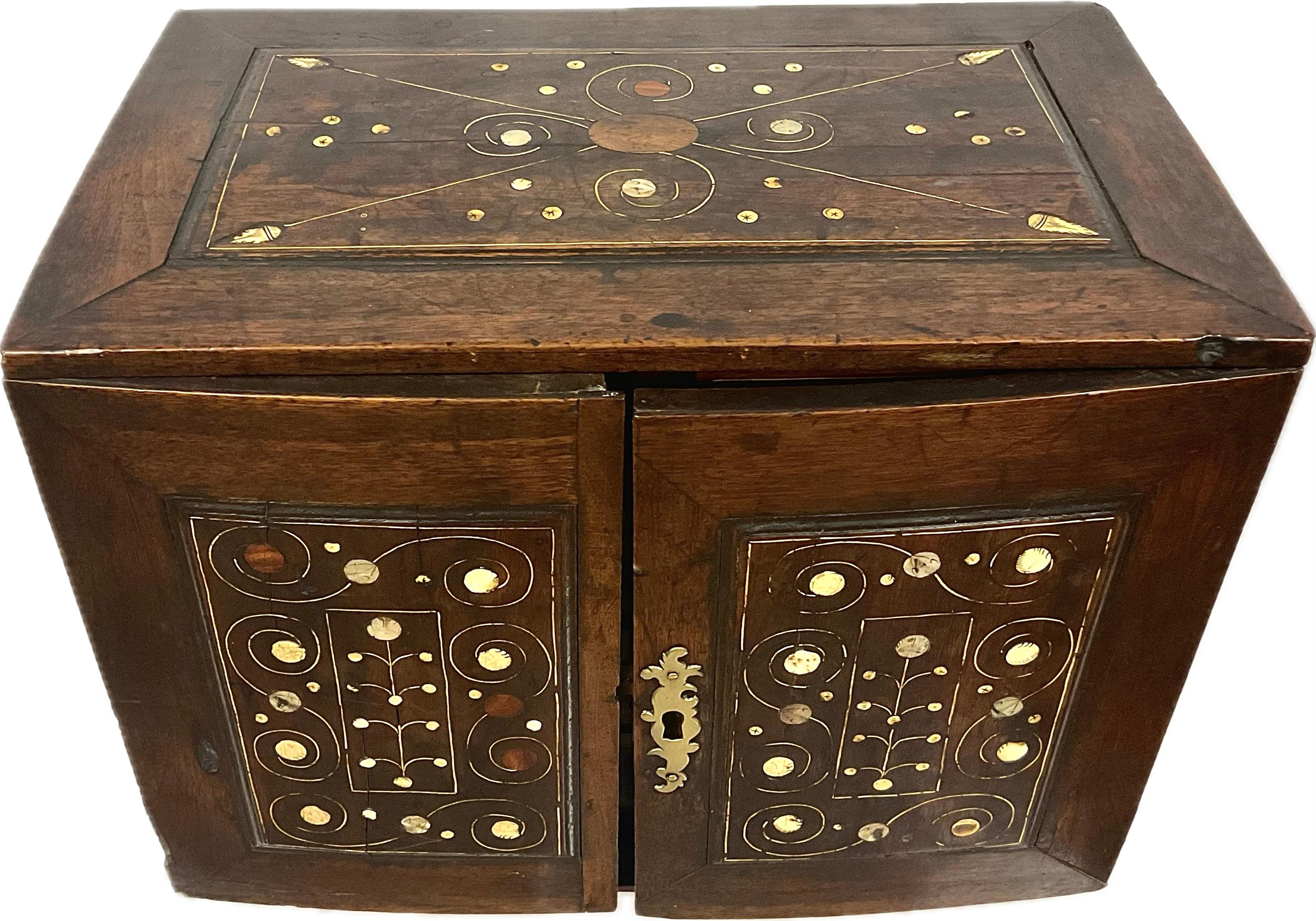 18th Century Inlaid Bone and Mother-of-Pearl inlaid Walnut Cabinet. Beautiful cabinet features inlaid bone that creates contrast and texture while mother-of-pearl with it's iridescent shine, would catch the light and enhance the overall elegance of