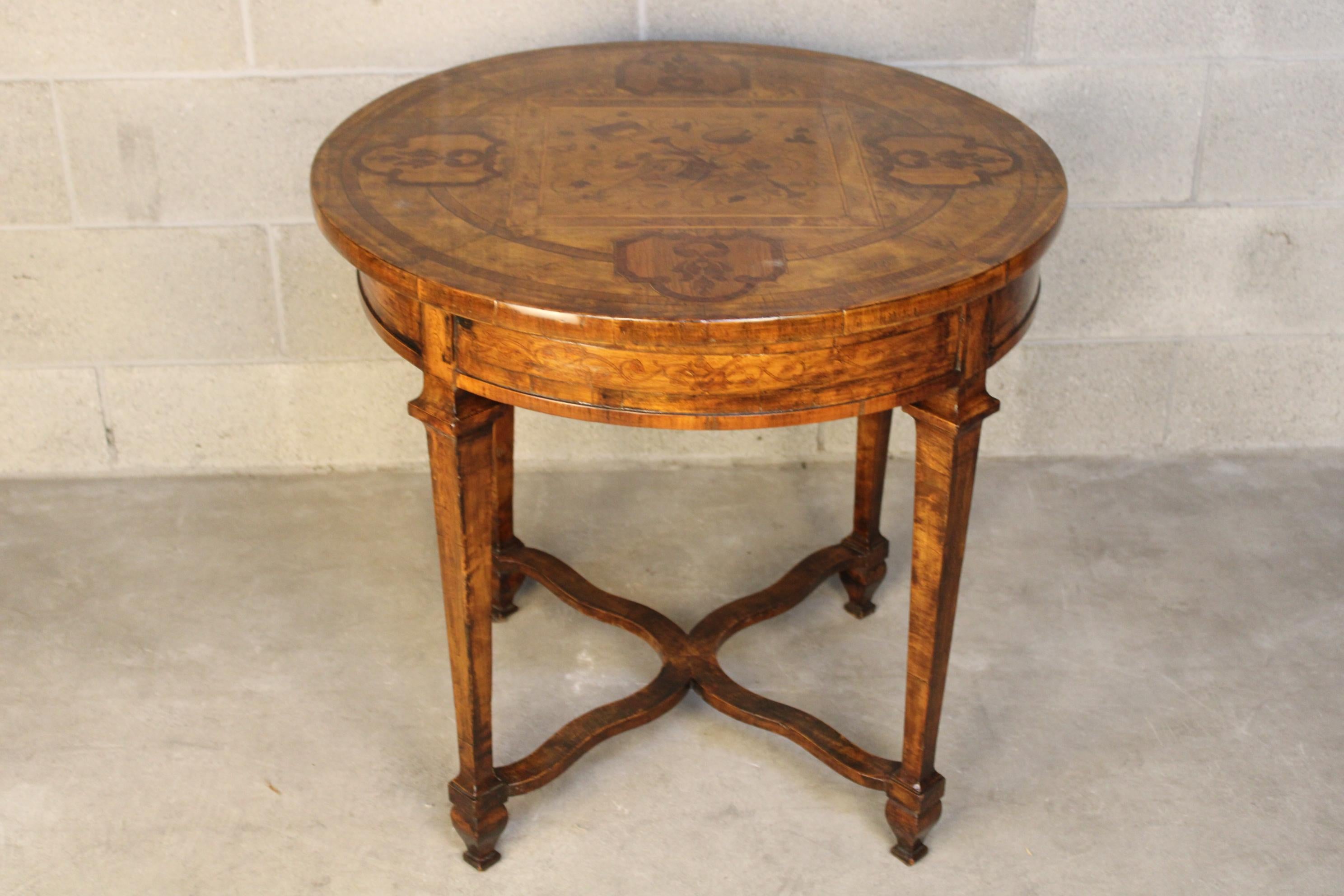19th century Louis XVI style  inlaid center table about 1790 France generally in very good condition. Table has been restored . has been repaired some few inlaid motifs lightly. and has been restored some color changings by proffesional