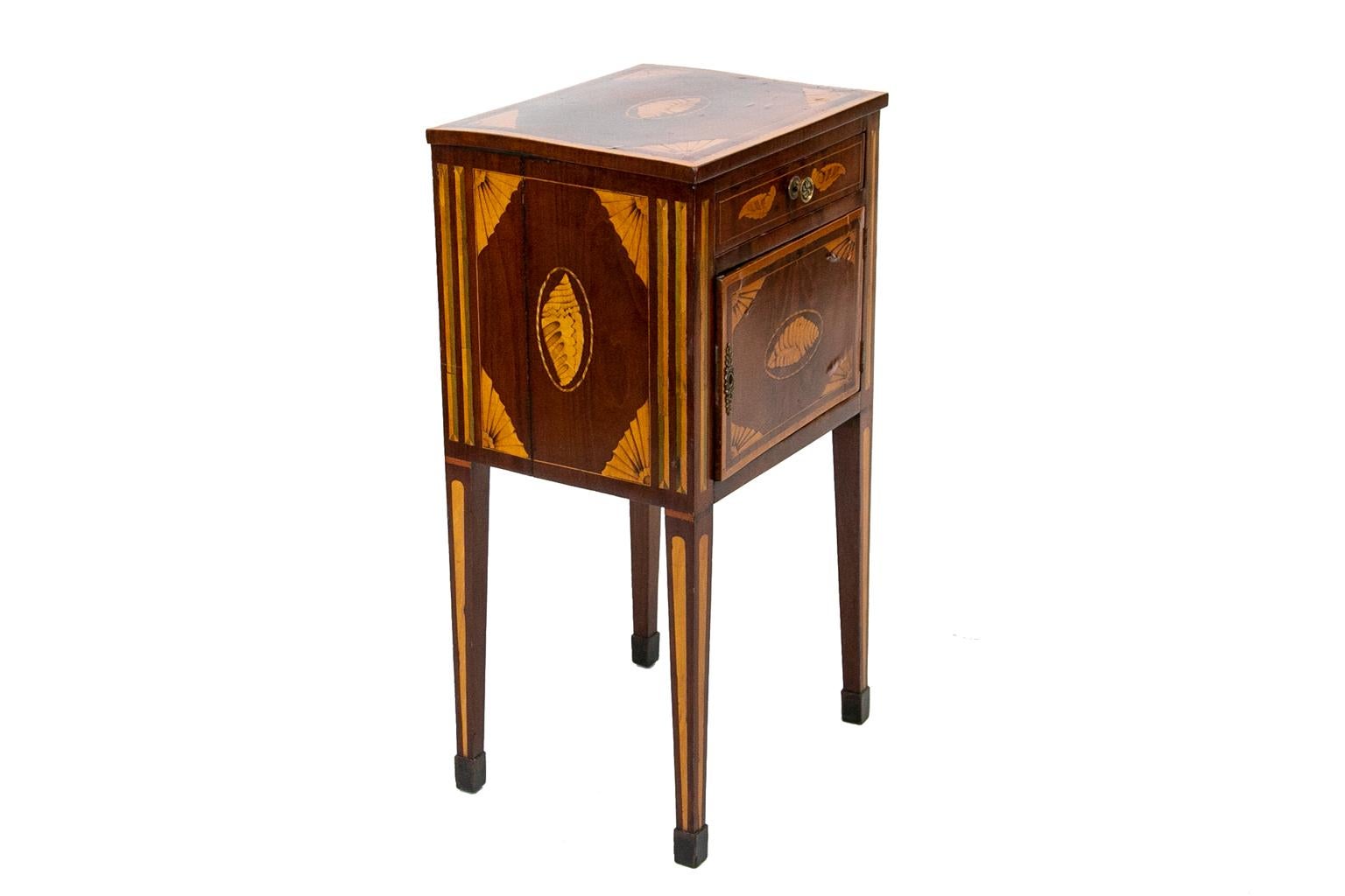 18th century inlaid hepplewhite one-drawer commode, with quarter fan and shell inlays on the top, front and sides, inlaid panels on the legs. The wood is mahogany, satinwood, and boxwood.