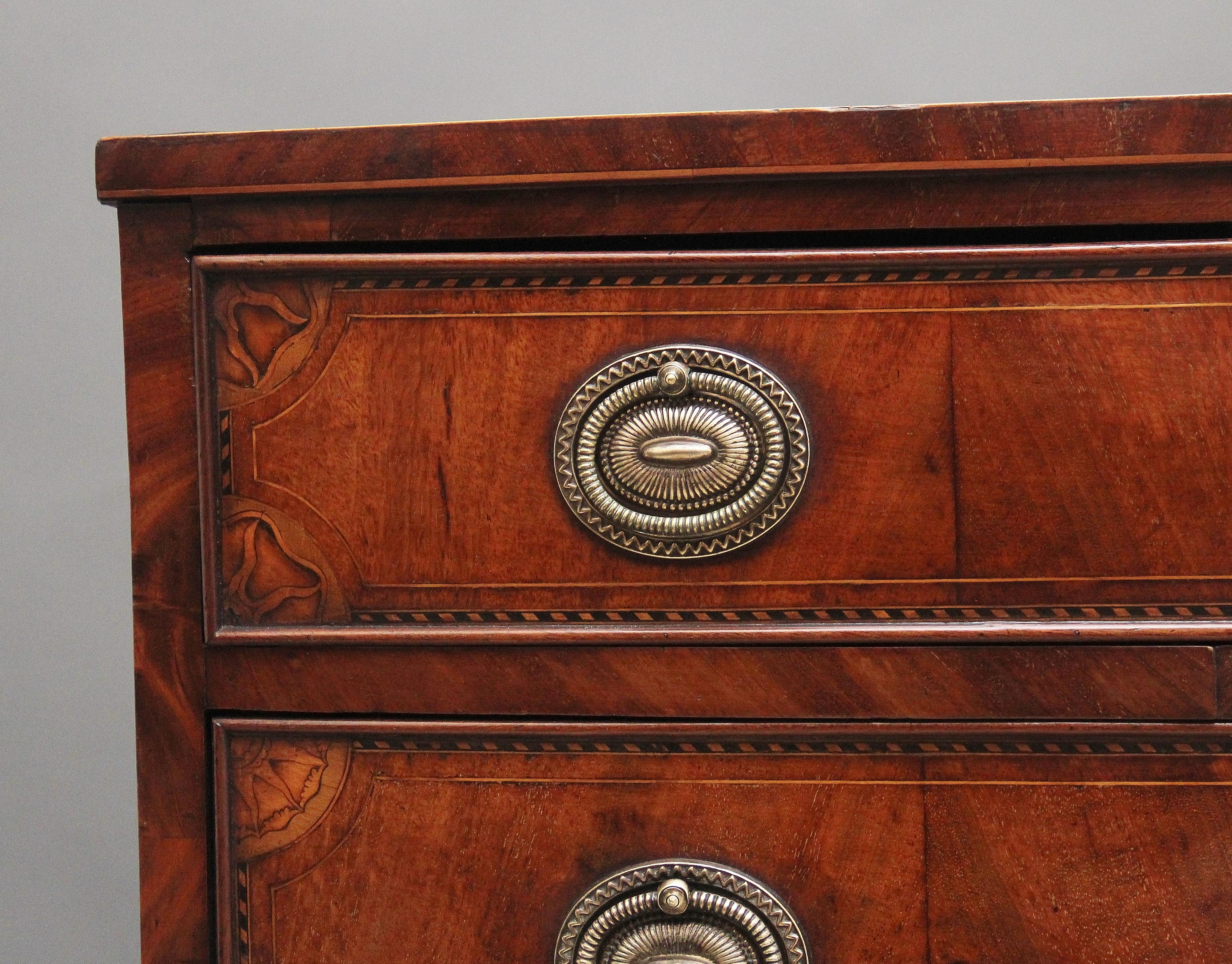 A fabulous quality 18th Century inlaid mahogany bowfront chest of drawers, having a lovely figured top decorated with chequered inlay, four long graduated drawers below with finely engraved oval brass plate and ring handles, wonderfully figured