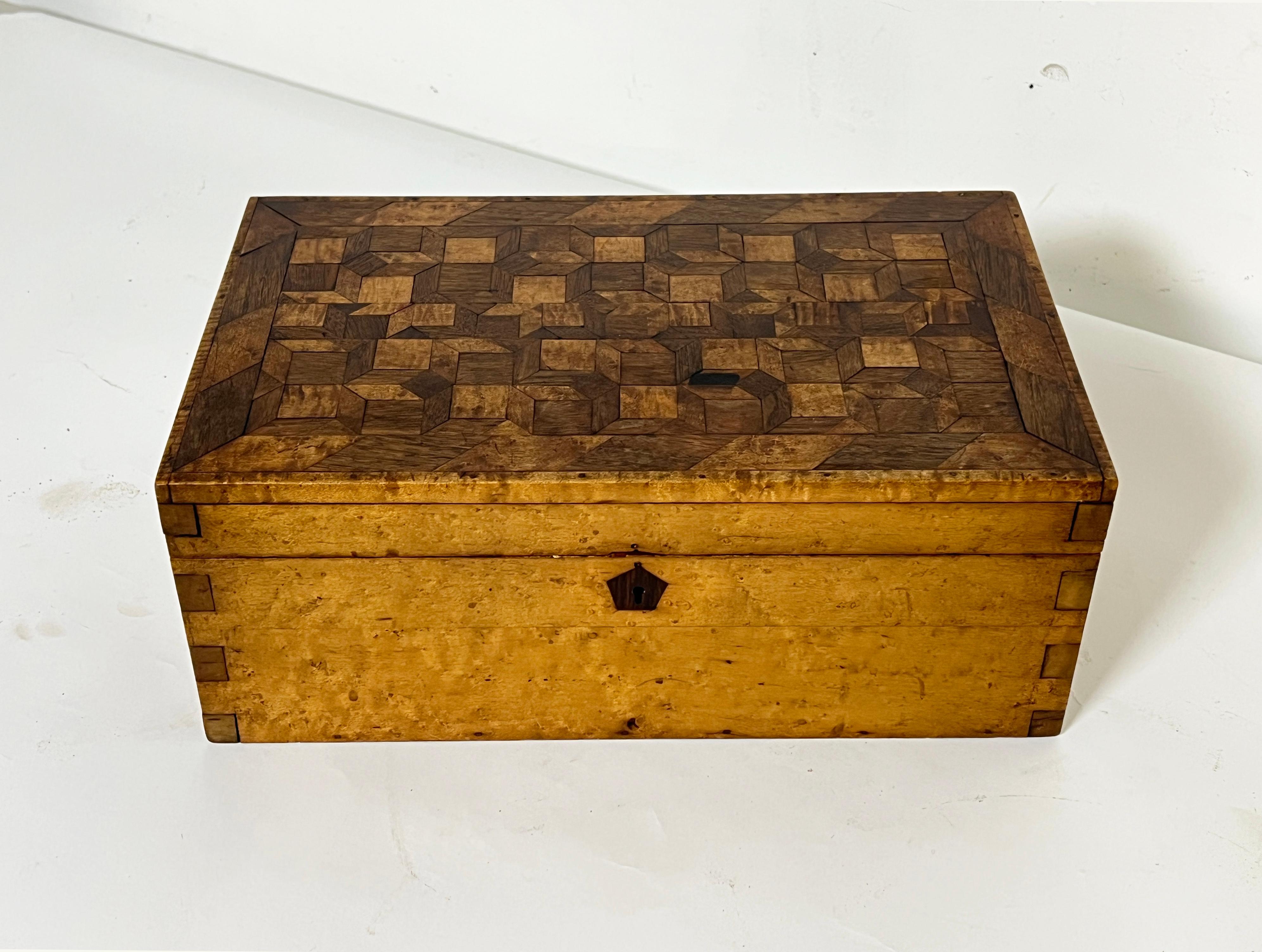 An antique 18th century New England dovetailed and boxwork inlaid document chest in butternet and walnut.
