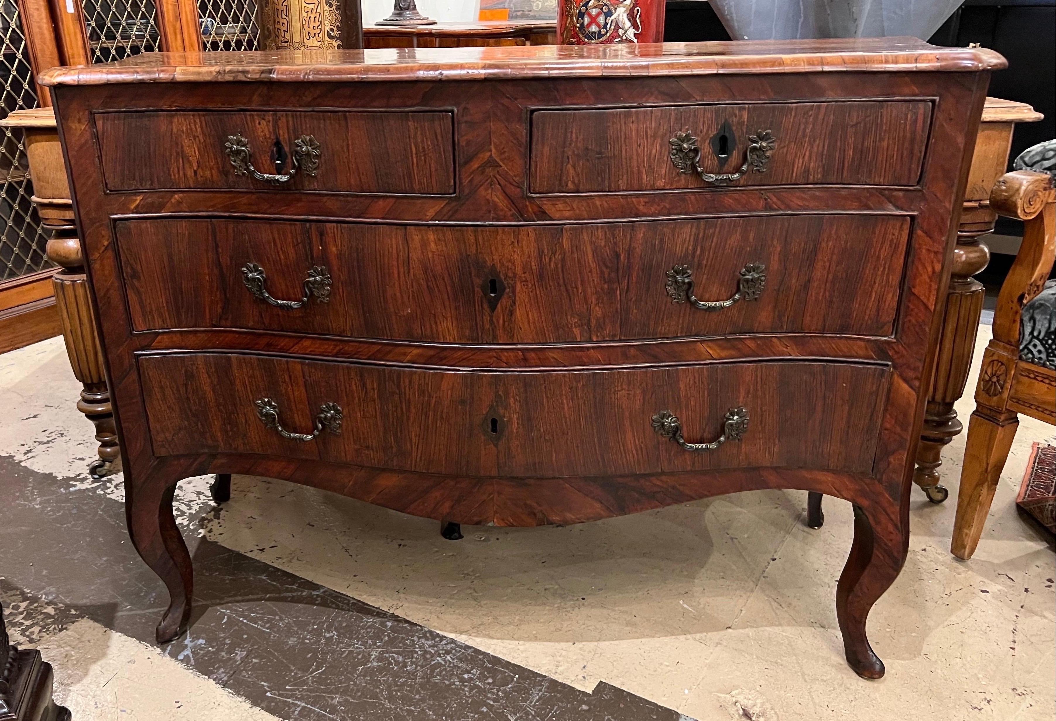 Gorgeous 18th century Swedish rococo inlaid chest of drawers. Diamond inlaid eschuteons, crossbanded top and original pulls on cabriole legs.
