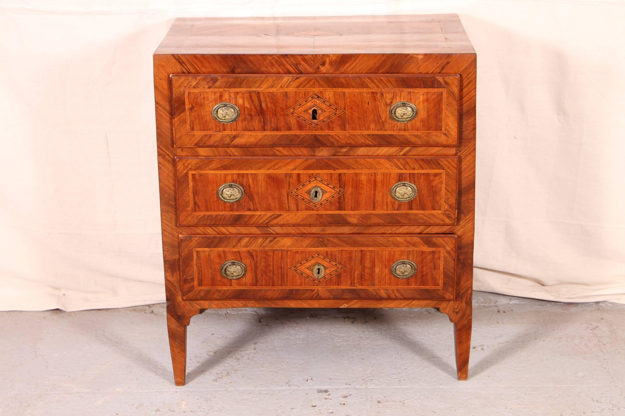 18th century inlaid walnut three-drawer commode, fine banded parquetry top with centre diamond motif and checked string inlay and complementary parquetry sides. The three long banded drawers also with diamond motifs, string inlays and with cast