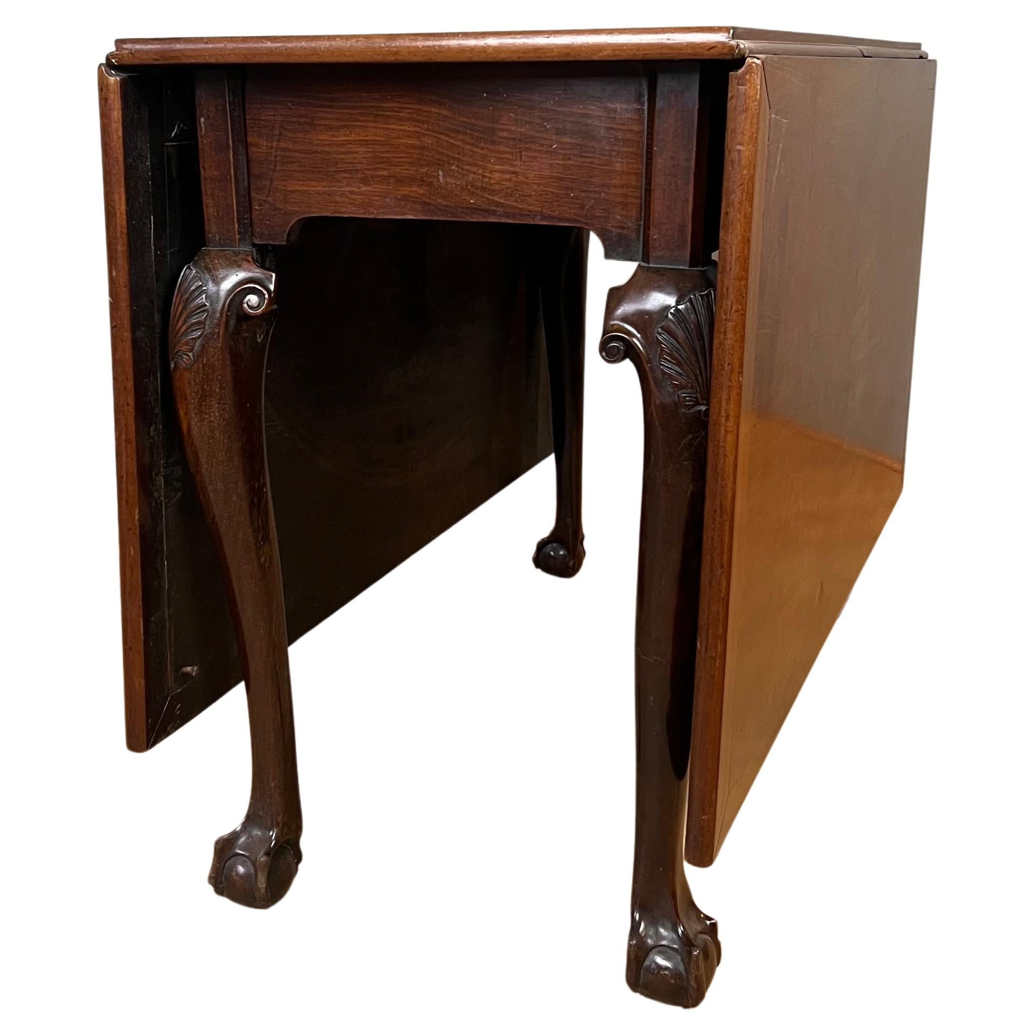 Made in 1750 out of the finest Cuban mahogany, this is a extremely handsome Irish gateleg table. The timber has wonderful mellow caramel hues and the top is unusual being clamped ended to keep it straight. The elegant cabriole legs have scroll ear