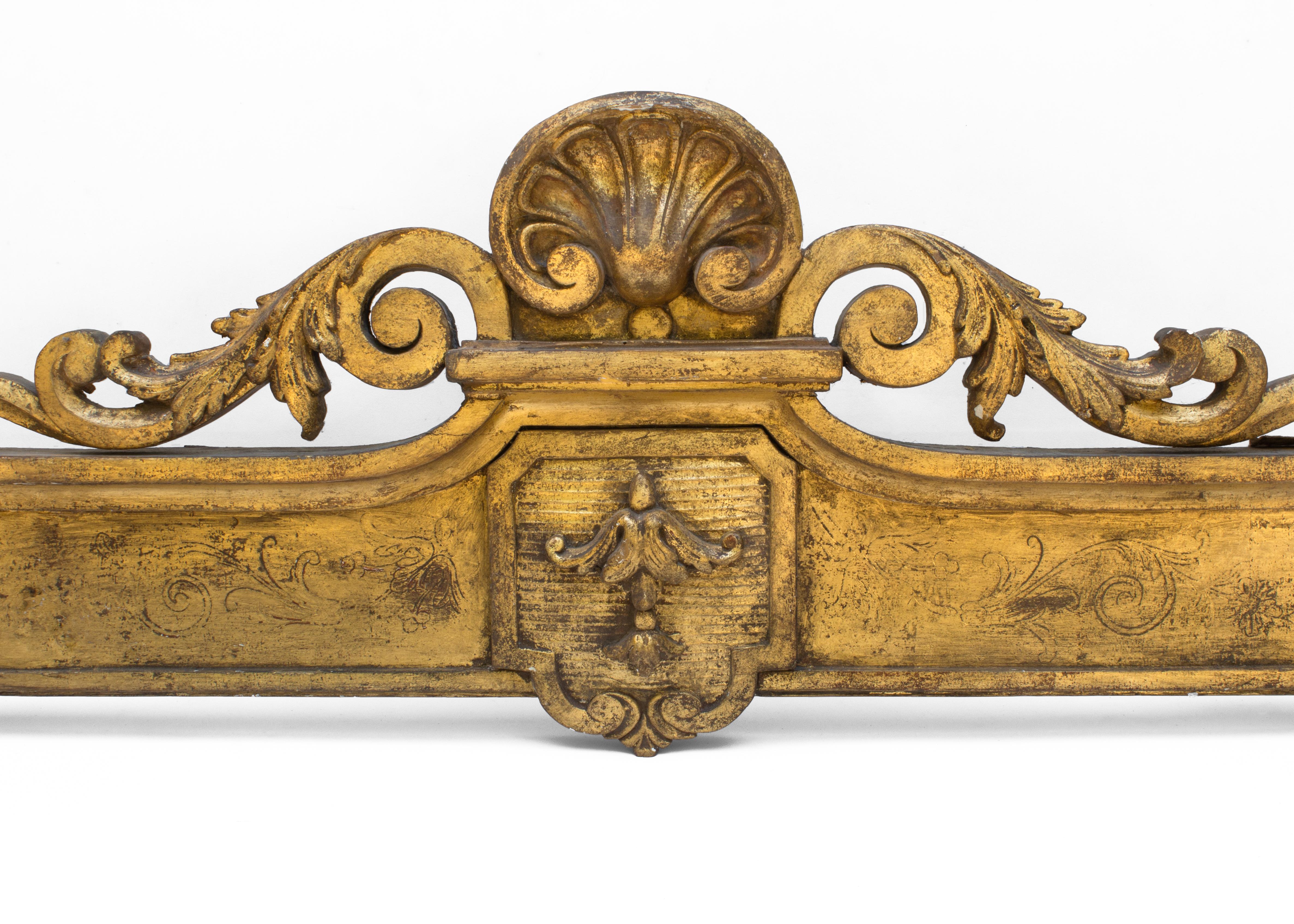 18th century Irish Georgian gold leaf curtain pelmet. This can also be used as a canopy bed corona. It is from a stately home in County Kildare, Ireland. It has intricate and detailed wood carvings with inscriptions on the pelmet.