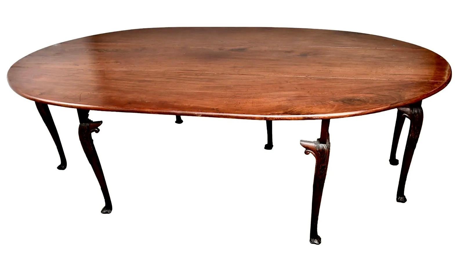 Irish Georgian Large Wake Table. Dining Table.  Great Mahogany board top.  Legs with carved knees and Spanish feet.  Legs and apron retaining 