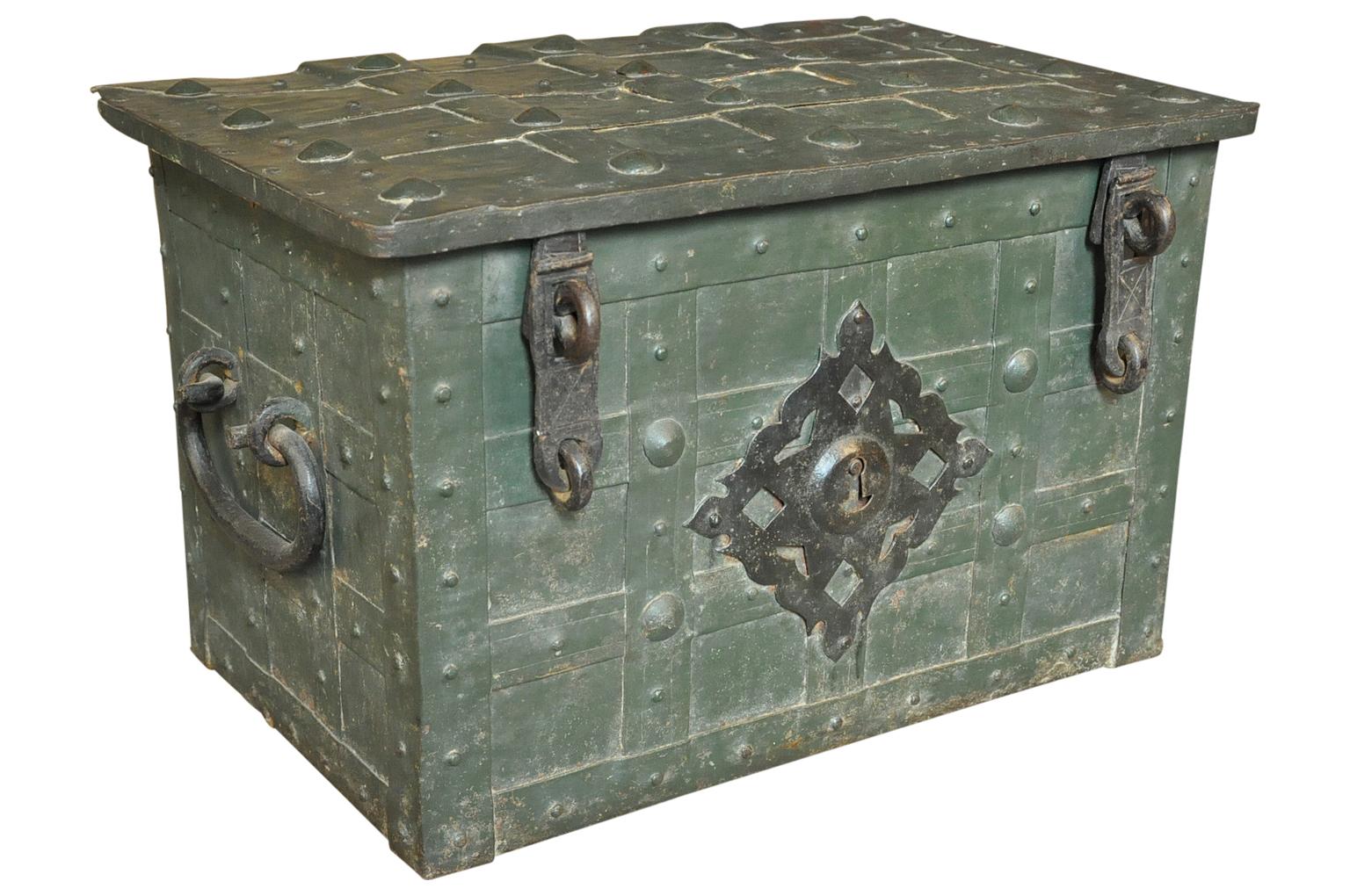 A very handsome 18th century strong box, safe trunk, expertly crafted from painted iron with a fascinating hidden locking mechanism. Wonderful as a coffee table or cocktail table as well.