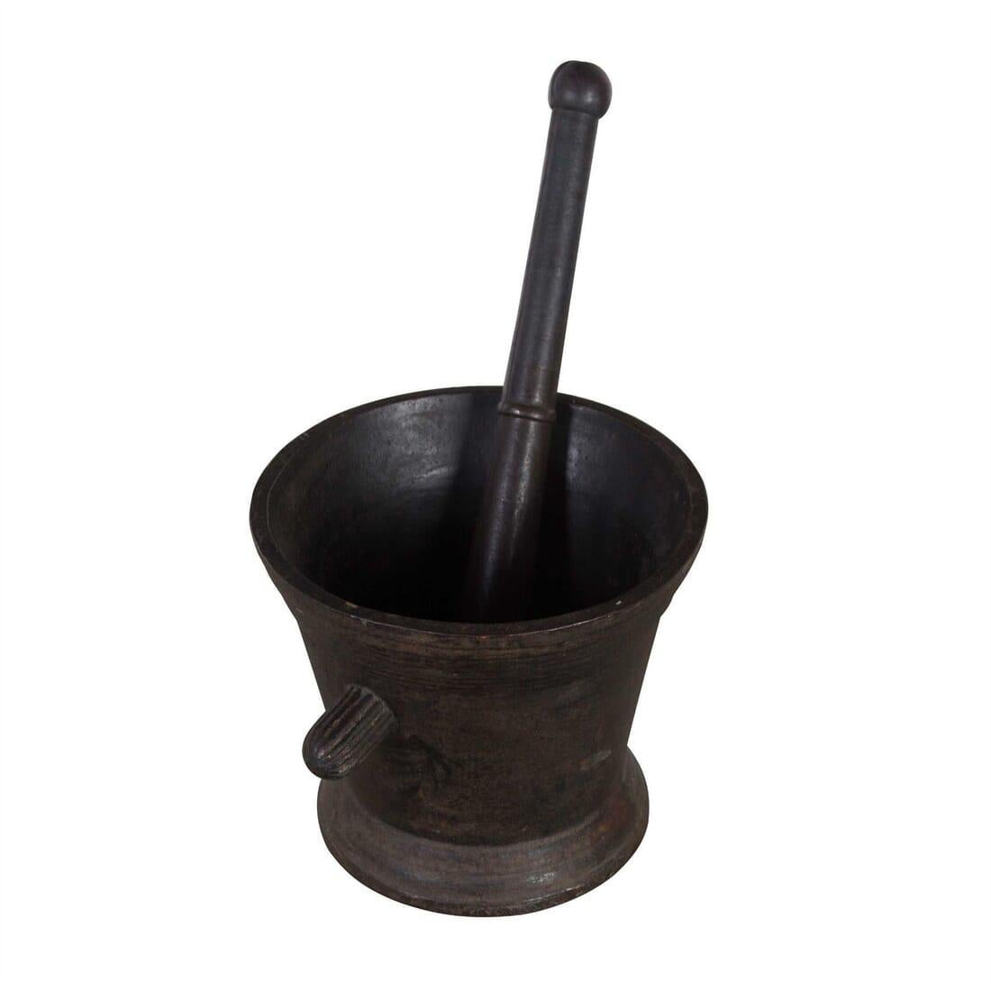 An 18th century iron pestle and mortar. Exceptional weight.