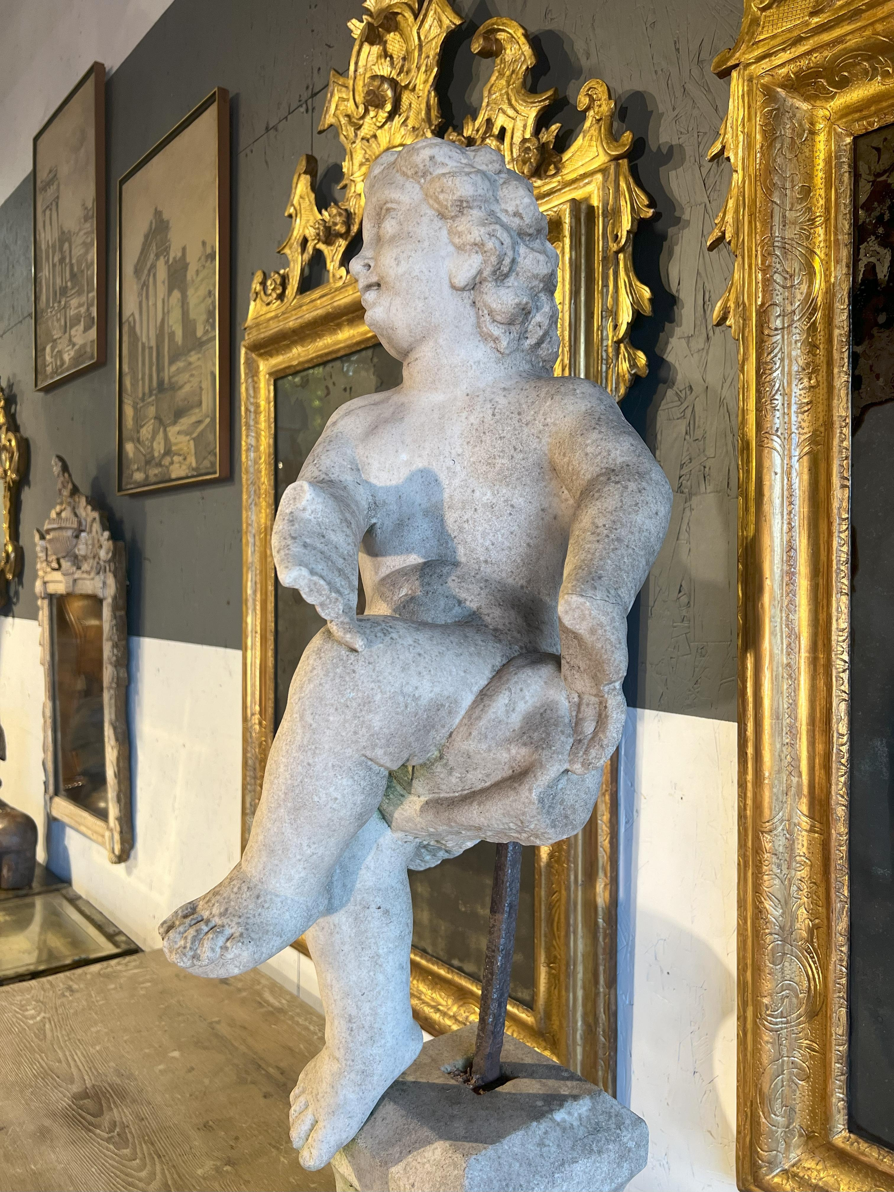 Marble 18th Century Italian Antique Dancing Putto small on a base.   For Sale