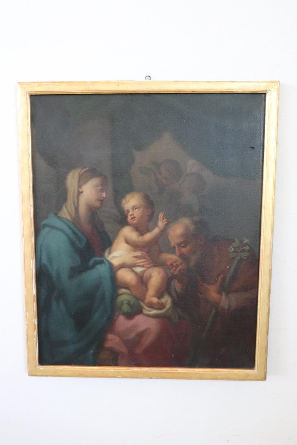 Beautiful antique Italian oil painting on canvas. Excellent pictorial quality great attention to detail. Italian school of the 18th century. Not signed. A beautiful religious painting representing the apparition of the Madonna and Child to Sant
