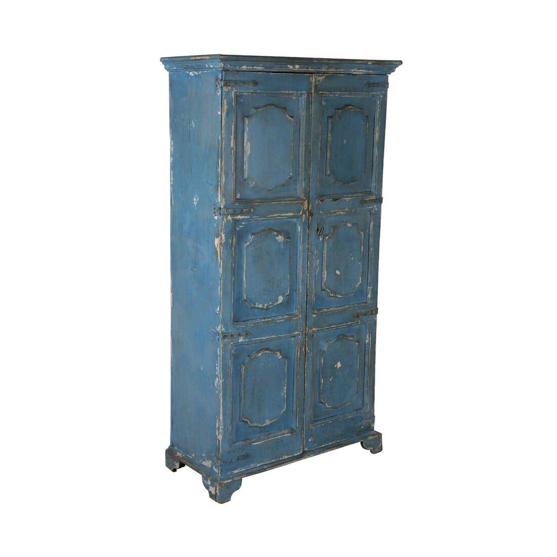 A charming late 18th century painted Italian armoire with panelled doors, petite proportions. Superb soft blue old painted finish with layers of historic paint showing through in places. Single shelf to interior, but could be adapted.