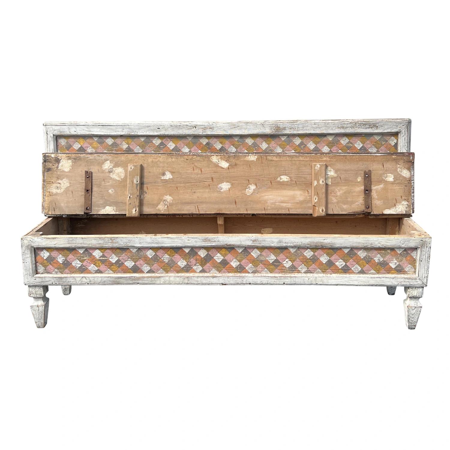A 18th century Tuscan bench hand painted in the Arte Povera technique, made of hand crafted Pinewood in good condition. This antique Italian seating furniture has a straight white framed back rest with a decorative panel and a Florentine geometrical