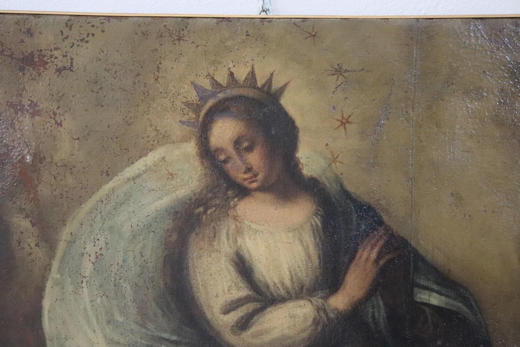 Beautiful oil painting on canvas 18th century not signed. Excellent pictorial quality. This painting represents a classical scene of the Catholic religion the Virgin is represented with a crown of stars with a blue cloak. You can see a demon head