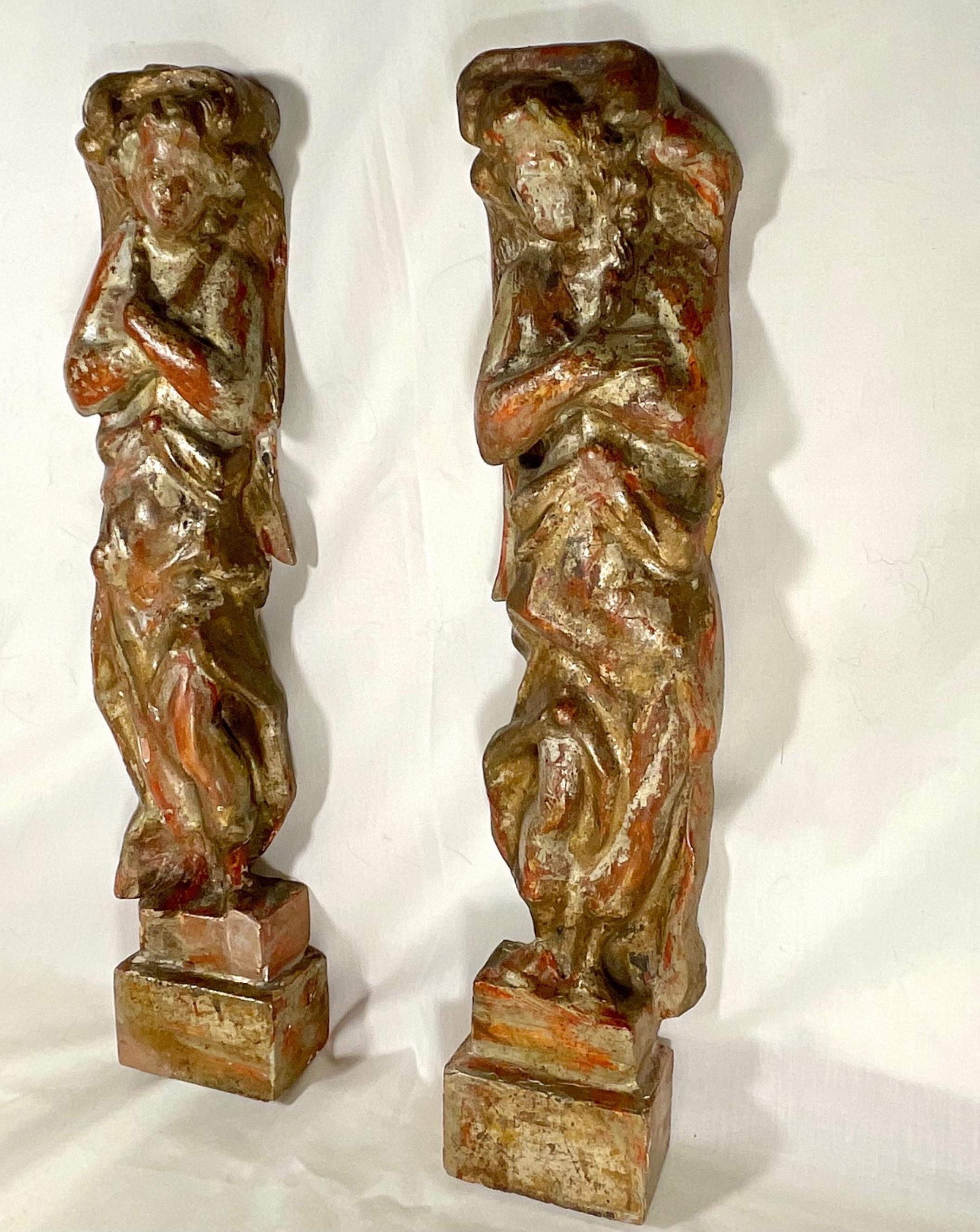 18th century Italian Baroque carved and polychrome flanking Angels.

A stunning pair of 18th century hand carved and polychrome angels of Italian origin. These two beautiful holy flanking angels are a true pair. They once adorned a sculptural center