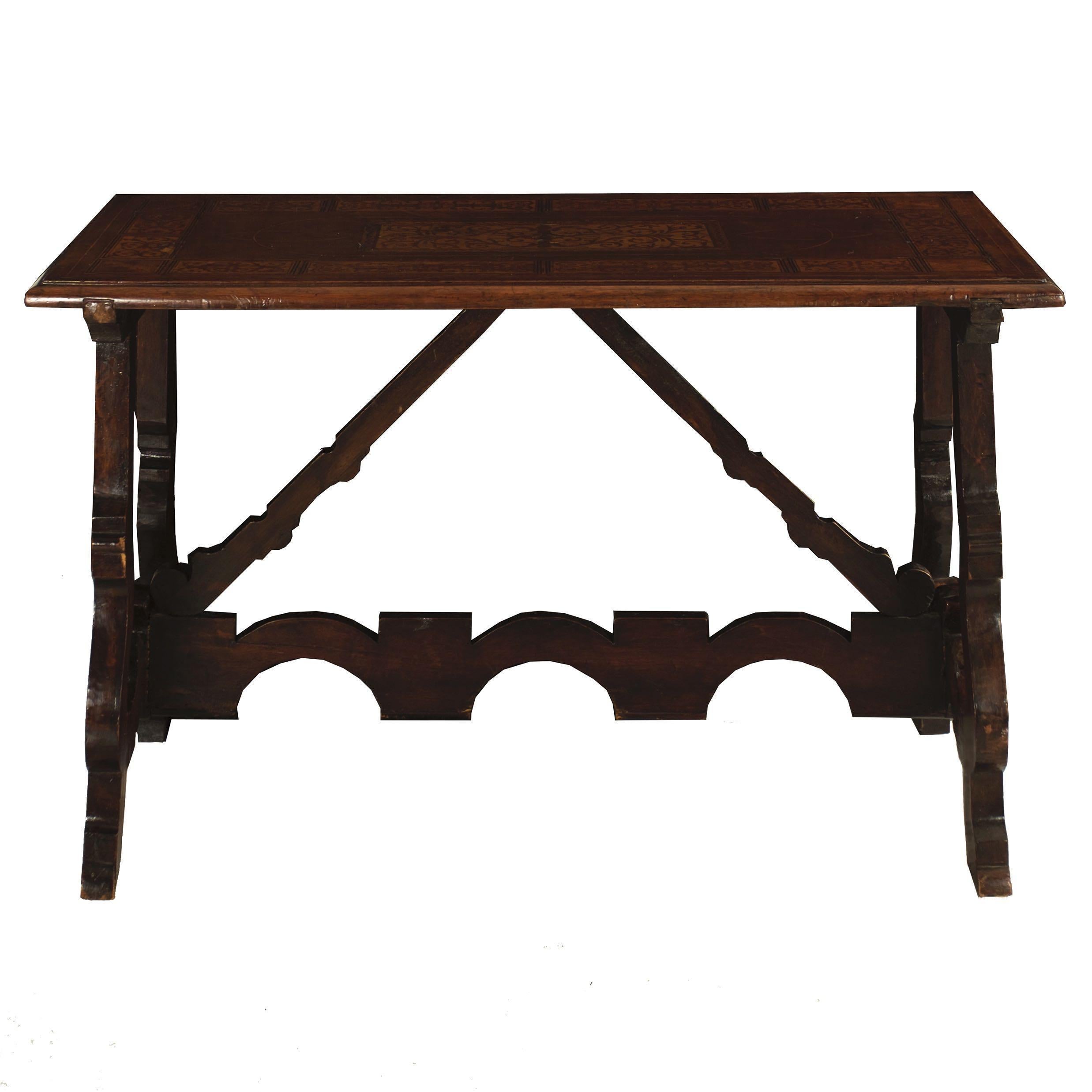ITALIAN BAROQUE INLAID WALNUT TRESTLE-BASE PIER TABLE
Probably Northern Italy, circa late 17th to early 18th century
Item # 010KTR22J 

Featuring a fine Marquetry inlaid top with wolf figural inlays in each corner, the rectangular top is divided