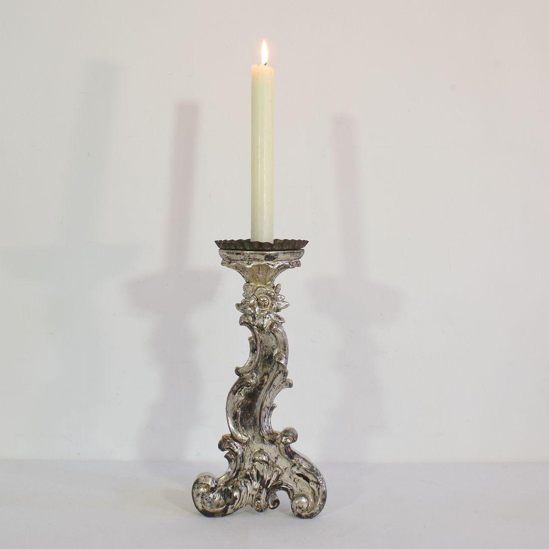 Great carved wooden candleholder with beautiful silver leaf,
Italy, circa 1750-1800.
Weathered and small losses.