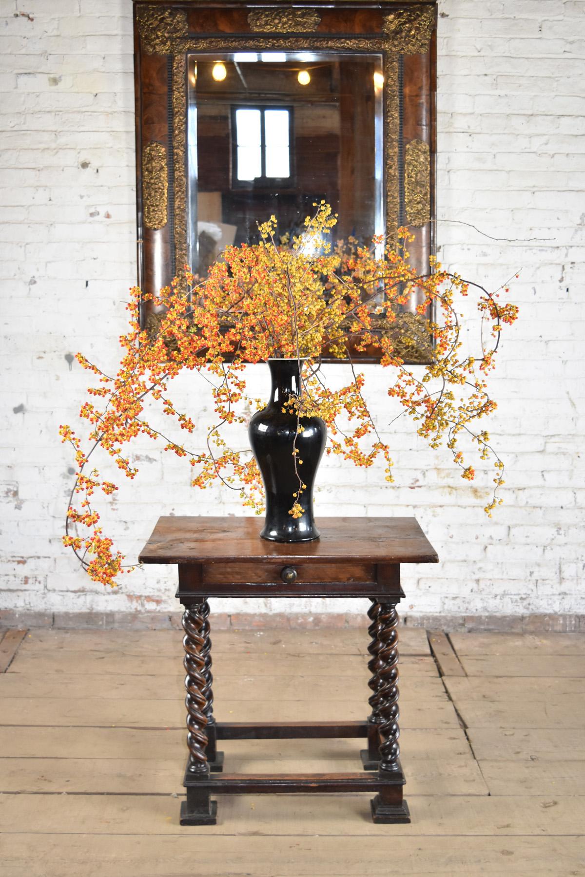 Small Italian early 18th century occasional table, the rectangular top above a frieze containing a drawer, supported by four twist-turned legs ending in block feet, connected by box stretchers. Made of solid walnut with a wonderful deep patina.