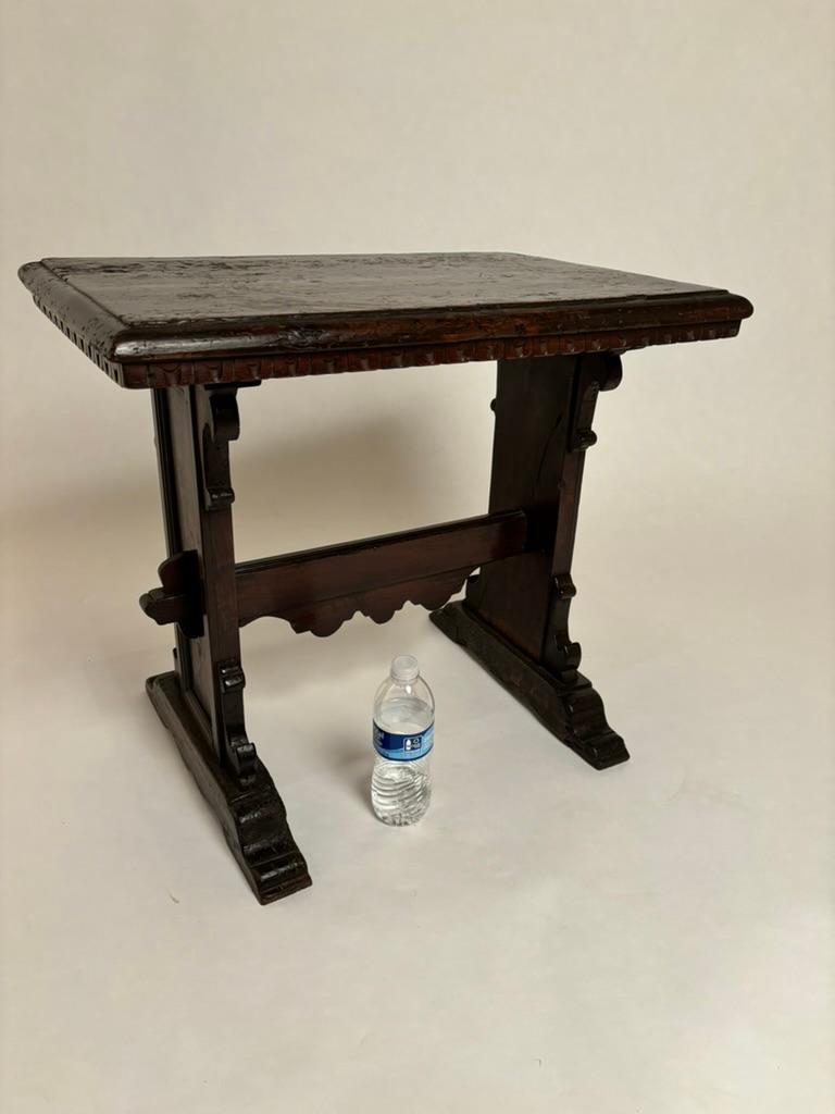 18th century Italian Tuscan Baroque side table with single stretcher. In the Tuscan style with panel sides, ogee brackets and  guilloche molding below the top. With old minor marks, chips and scratches commensurate with age. Old two inch strip