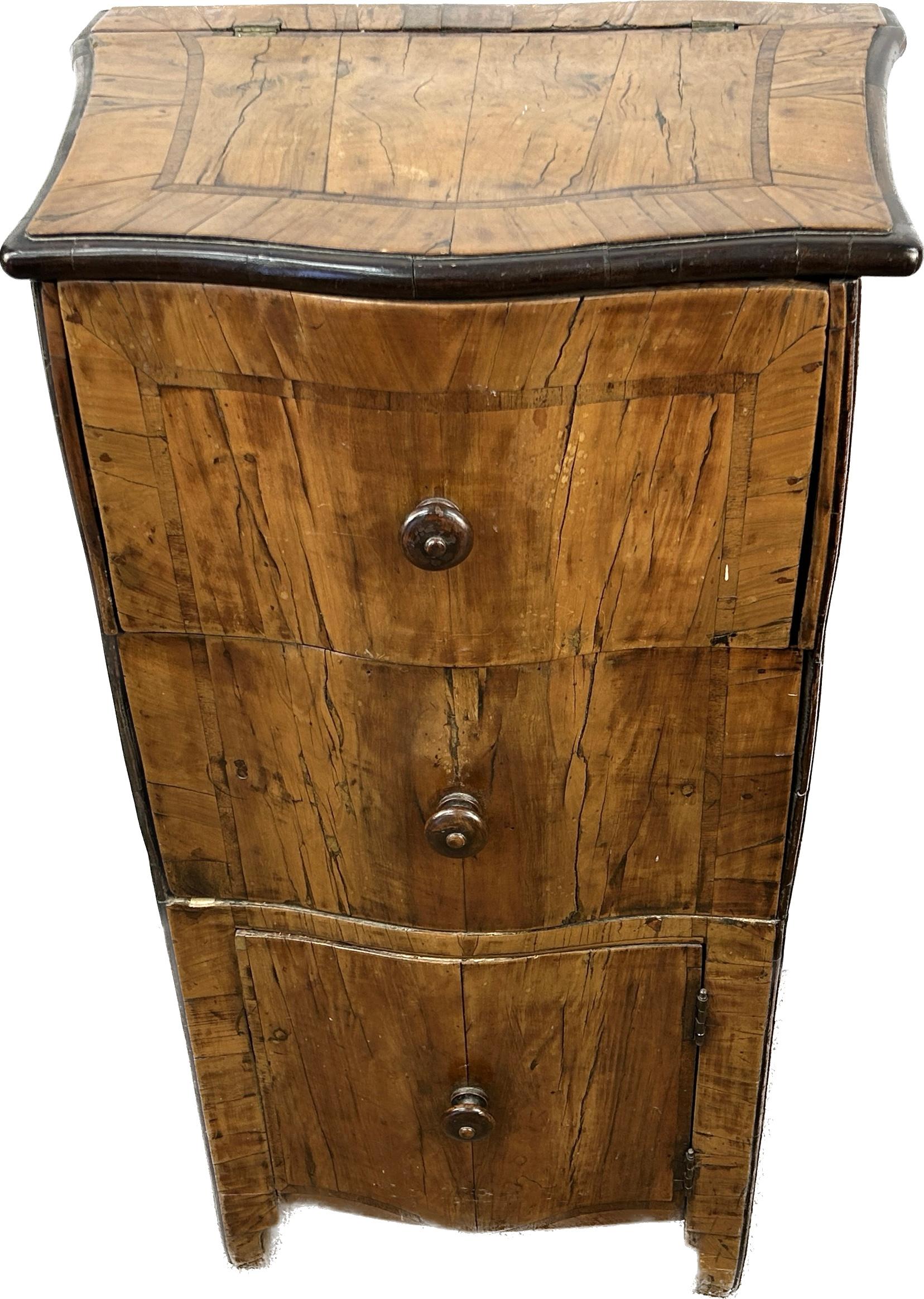 Unique 18th Century Italian Baroque style flip top walnut chest or nightstand. Chest has two deep drawers over a bottom door to a small nook for further storage. 
