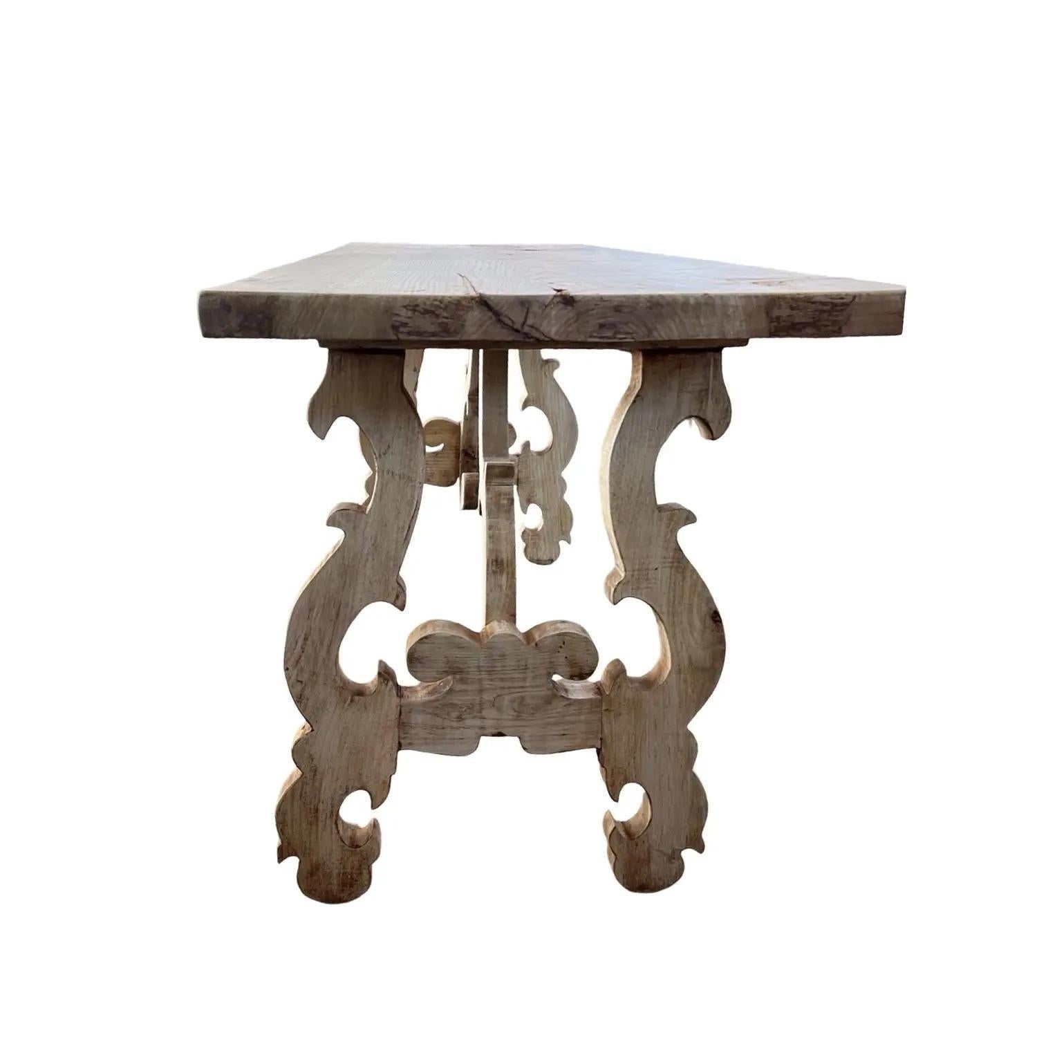 Fratino console table from the 1700s hand-made in Italy using walnut. The table has beautiful curvy lines given by the lyre legs that are balanced elegantly by the thick straight-edged top. The top is a fantastic 4cm (1.6 inches) thick single board