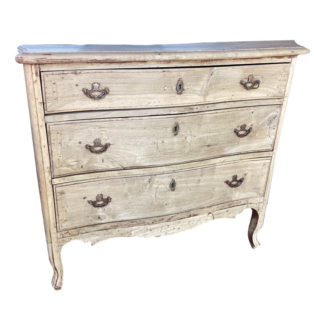 Chest of drawers hand-made in Italy in the mid 1700s using walnut and decorated by satin wood inlay. This is a gorgeous chest that has almost an ethereal look because of its delicate lines and light color. The chest sits on cabriole legs, decorated