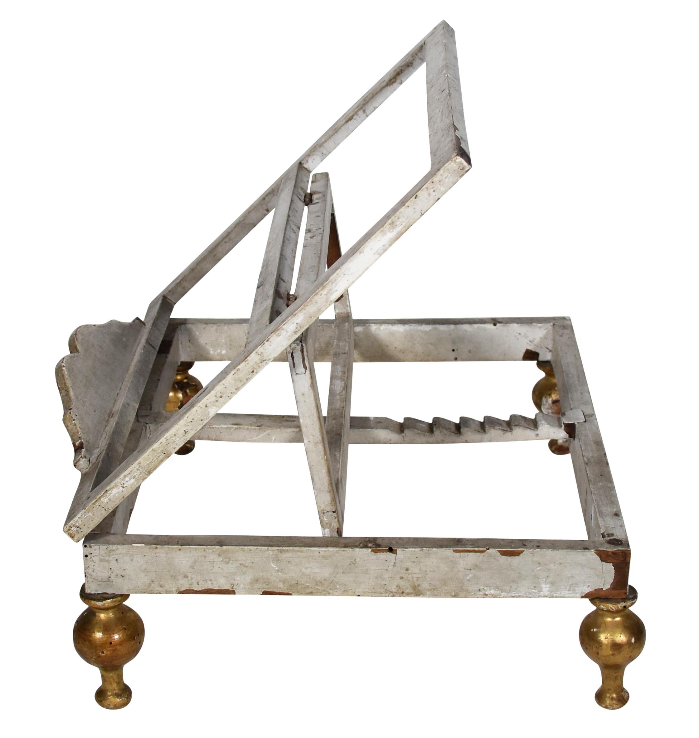 From Italy, this 18th century Italian painted and parcel-gilt carved table book stand or lectern with white patina is an elegant accessory to hold an esteemed book. It is a lovely large-scale book stand. 