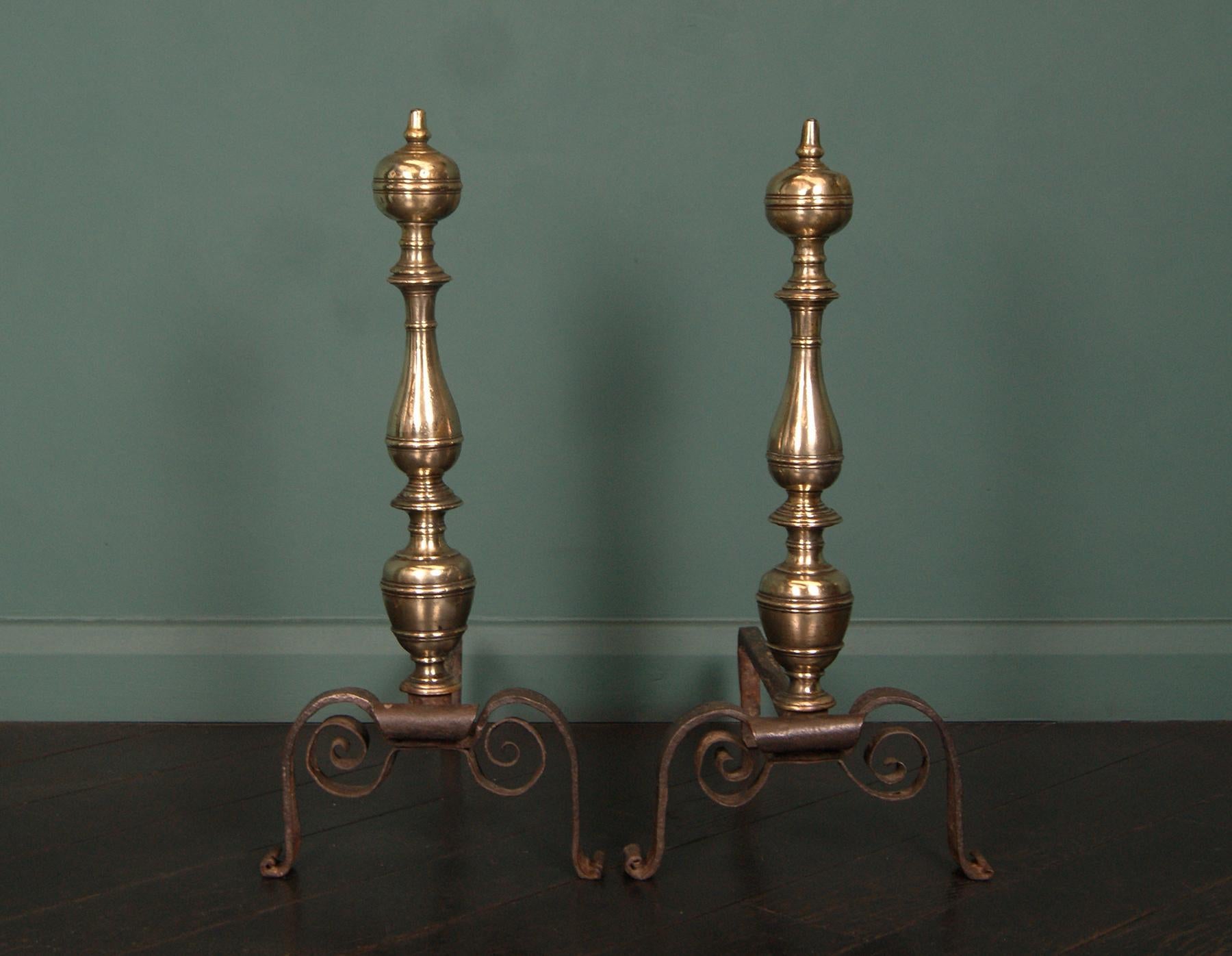 A beautiful pair of 18th century bronze and wrought iron andirons of good Size. The bronze turned standards supported on wrought scrolled arched supports. Log supports at rear.
Circa 1750