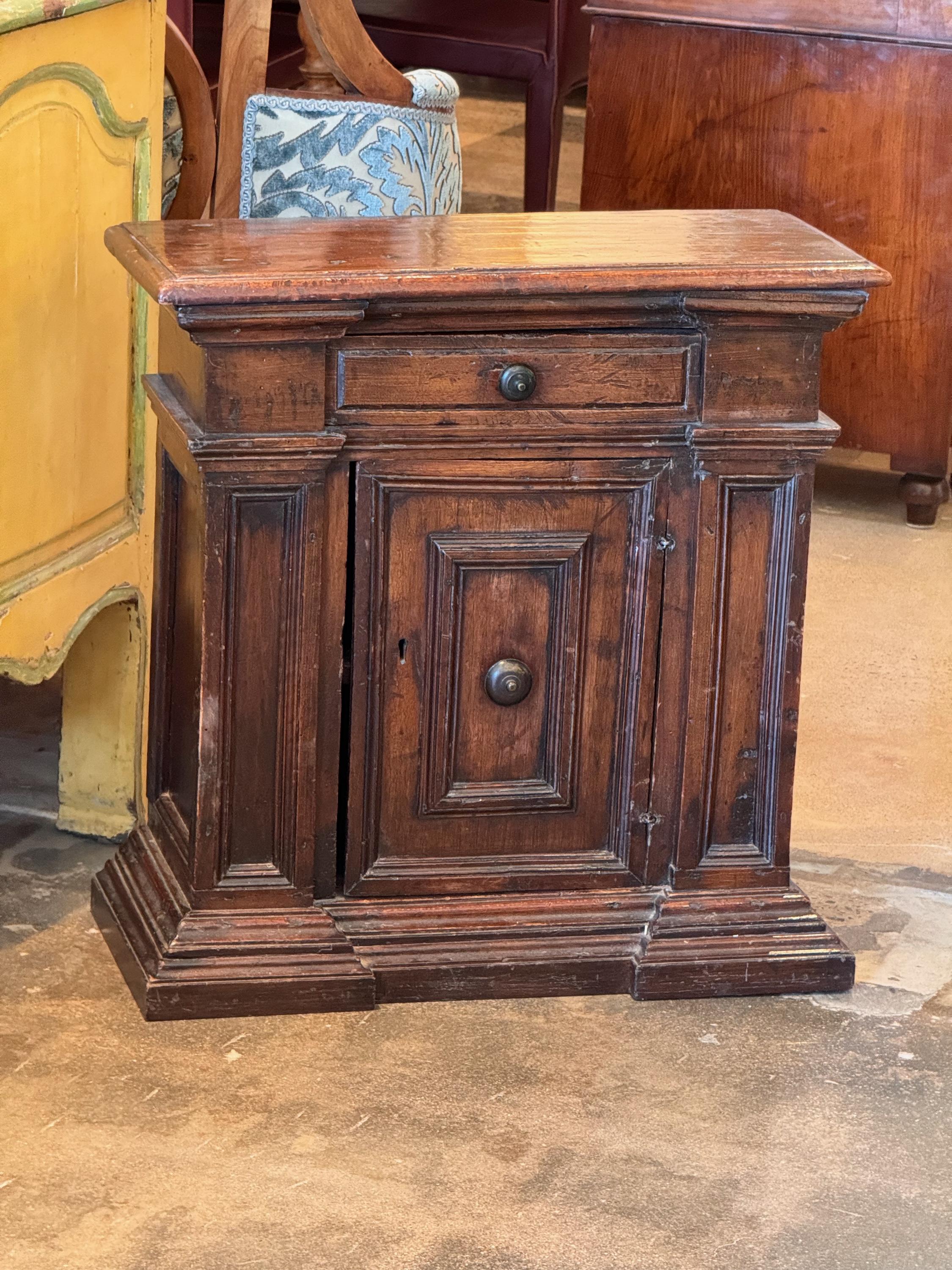A small Italian cabinet. Nicely carved.