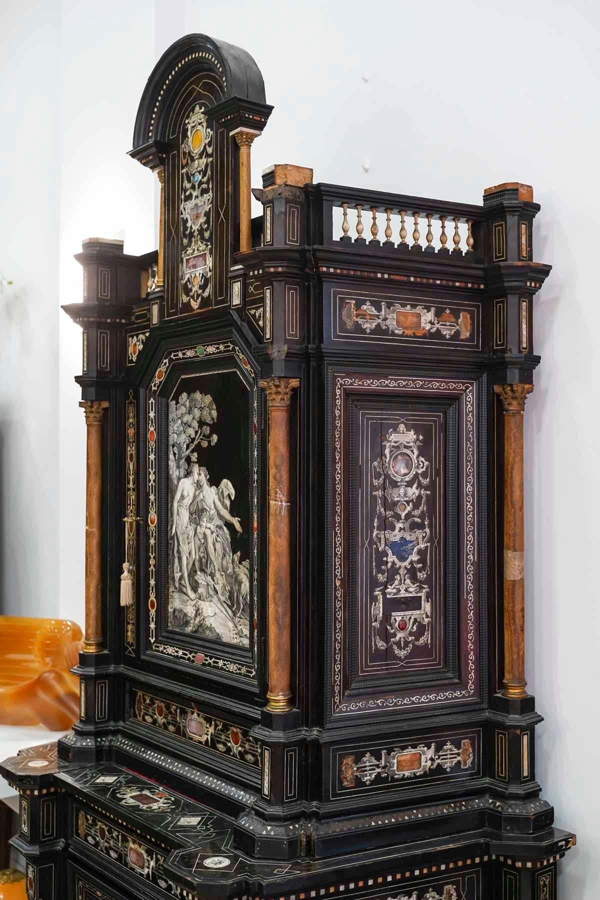 18th Century Italian Cabinet in Ebony, Ivory, Hard Stone Inlay, Secret Drawers.

18th century Italian cabinet in ebony, ivory, hard stone inlay, secret drawers. Lack and restoration to be expected, sold as is.
h: 250cm, w: 120cm, d: 63cm