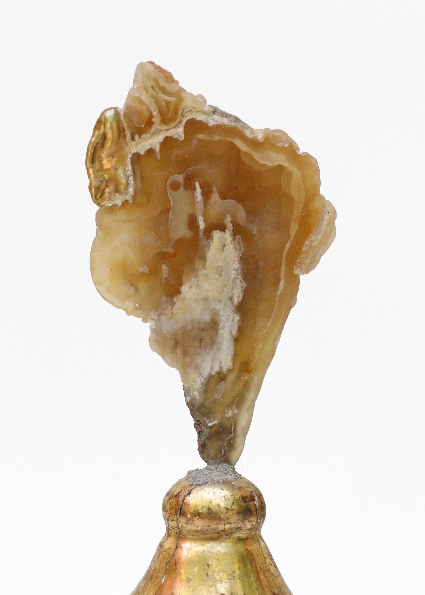 18th century Italian candlestick top with polished agate coral and a baroque pearl.

The 18th century candlestick top originally came from a candlestick from a church in Tuscany. The piece stands on the candlesticks' original metal drip pan
