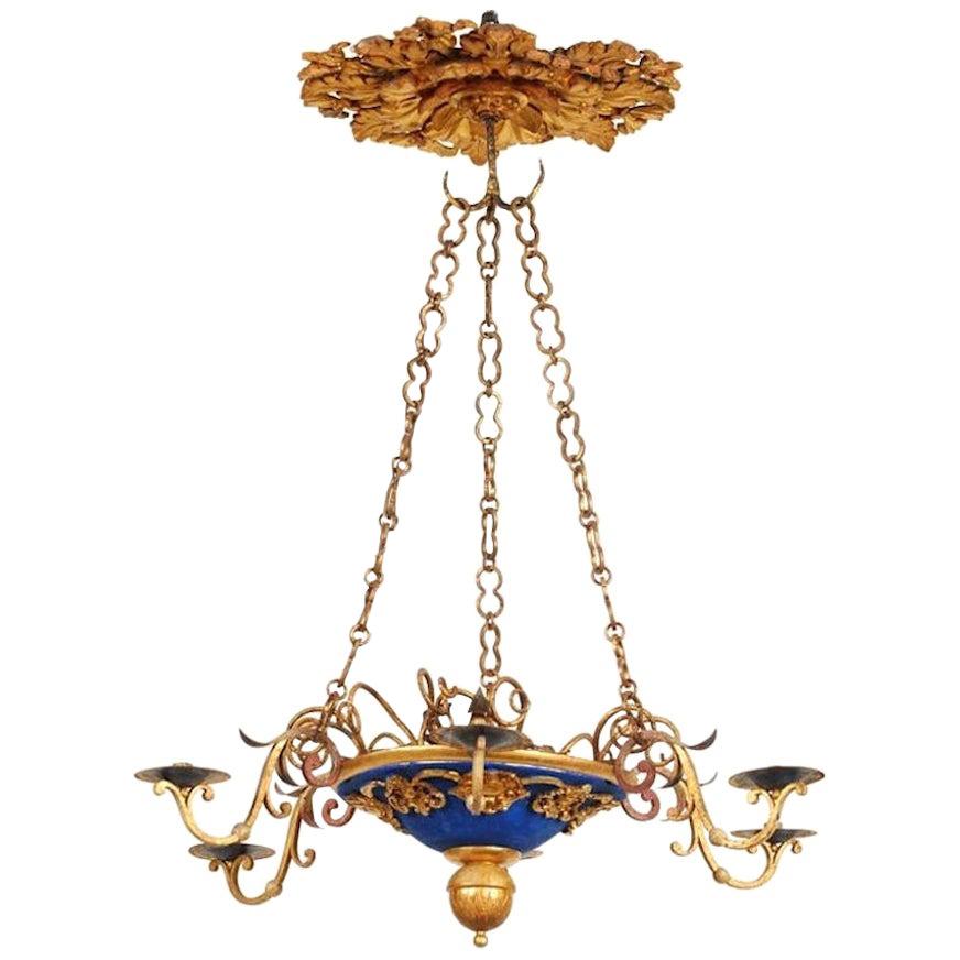 lustre italien du 18ème siècle en bois sculpté et doré en vente