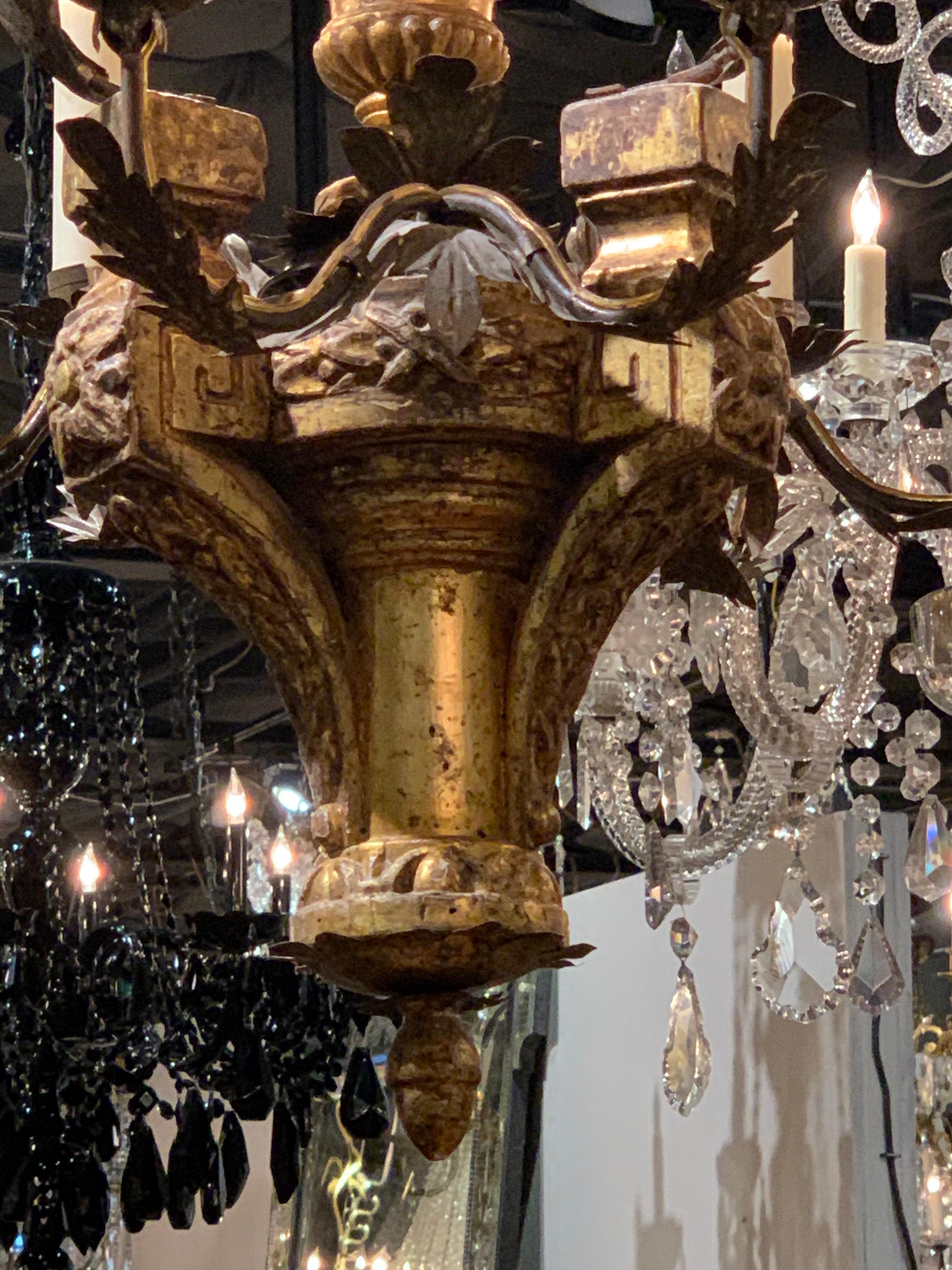 Handsome 18th century Italian carved and giltwood 6-light chandelier. Very nice patina and beautiful shape and scale. An elegant piece!