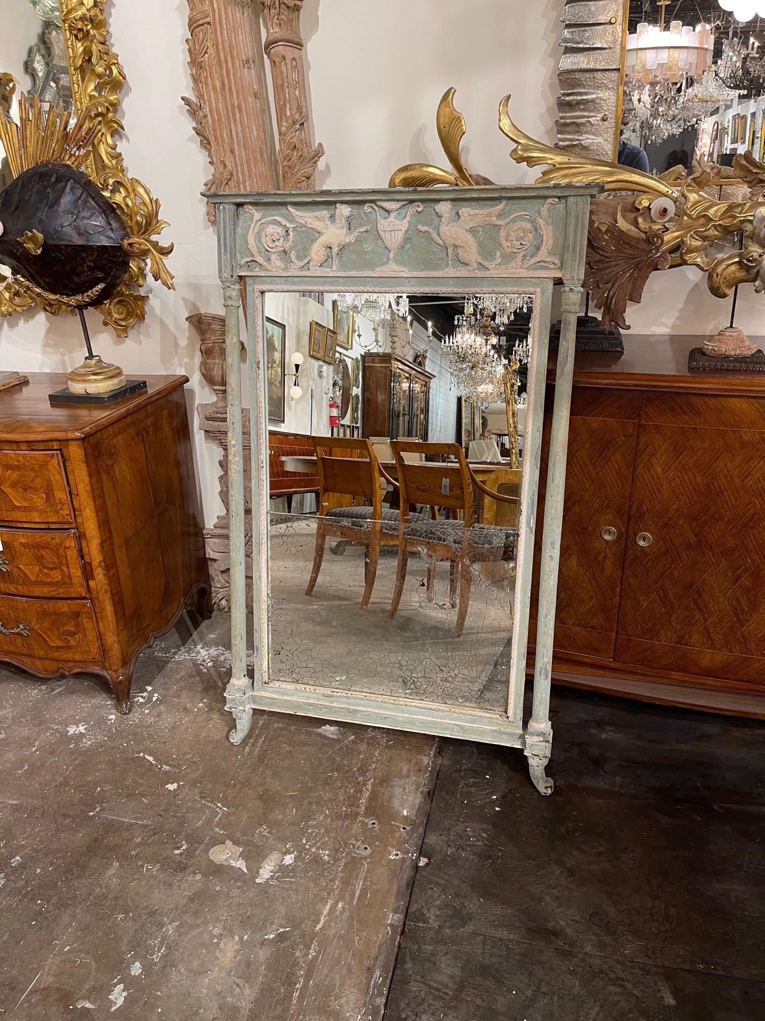 Lovely 18th century Italian carved and painted neoclassical style mirror. Interesting carved images including an urn and some dragons. Beautiful bluish green and white patina. Very pretty!