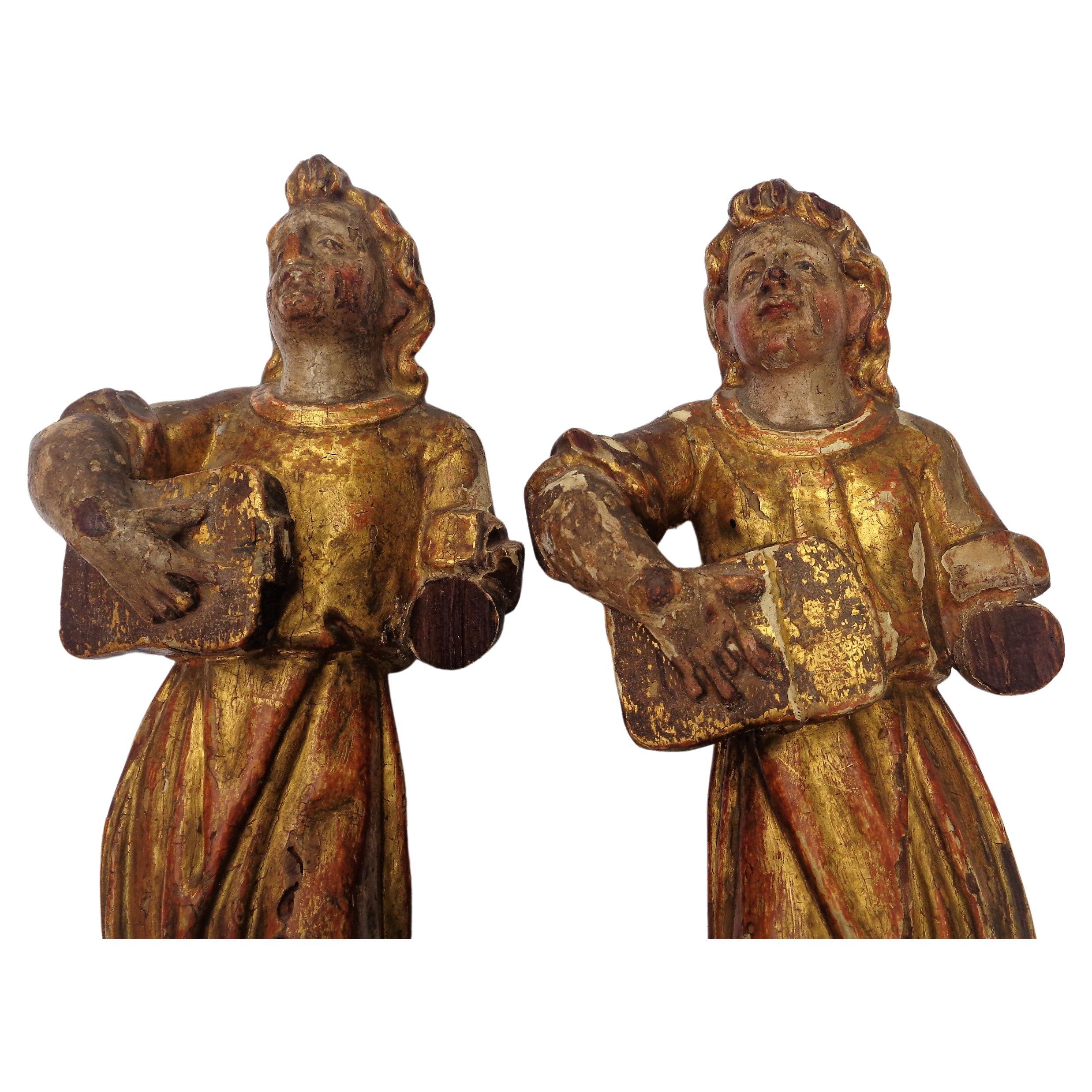 Pair of 18th century hand carved Italian angel figures w/ lutes. Beautifully aged original gilded and polychrome painted surface w/ areas of underlying red bole and gesso showing. Exceptionally great looking finely detailed 250 year old carvings.