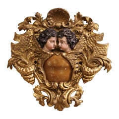 Scultura da parete in legno dorato intagliato e policromo del XVIII secolo con cherubini