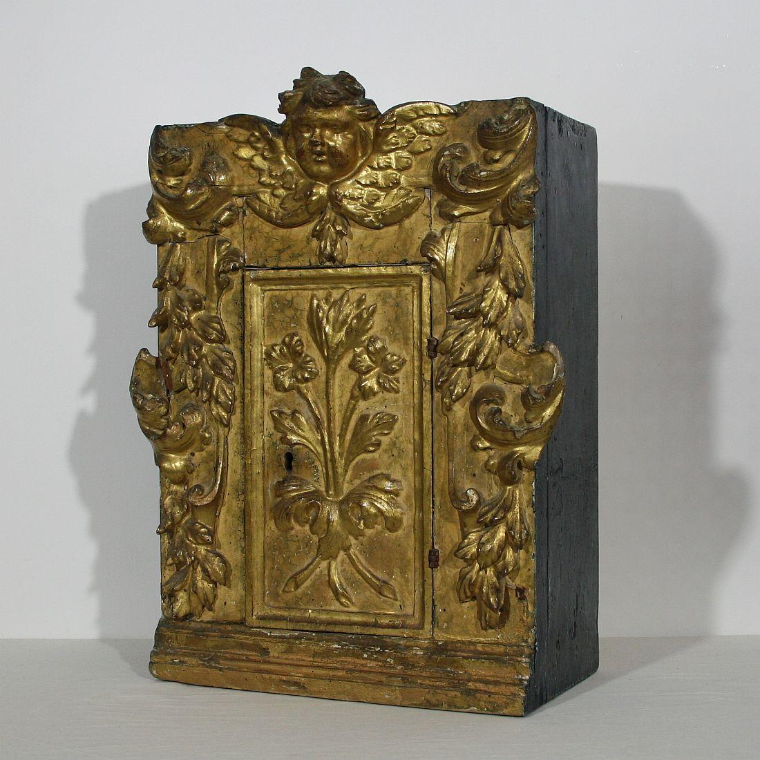 Unique tabernacle with its original gilding. Great piece to display a small private collection. Great color and beautiful angel face, Italy, circa 1700-1750.
Weathered, small losses and old repairs.