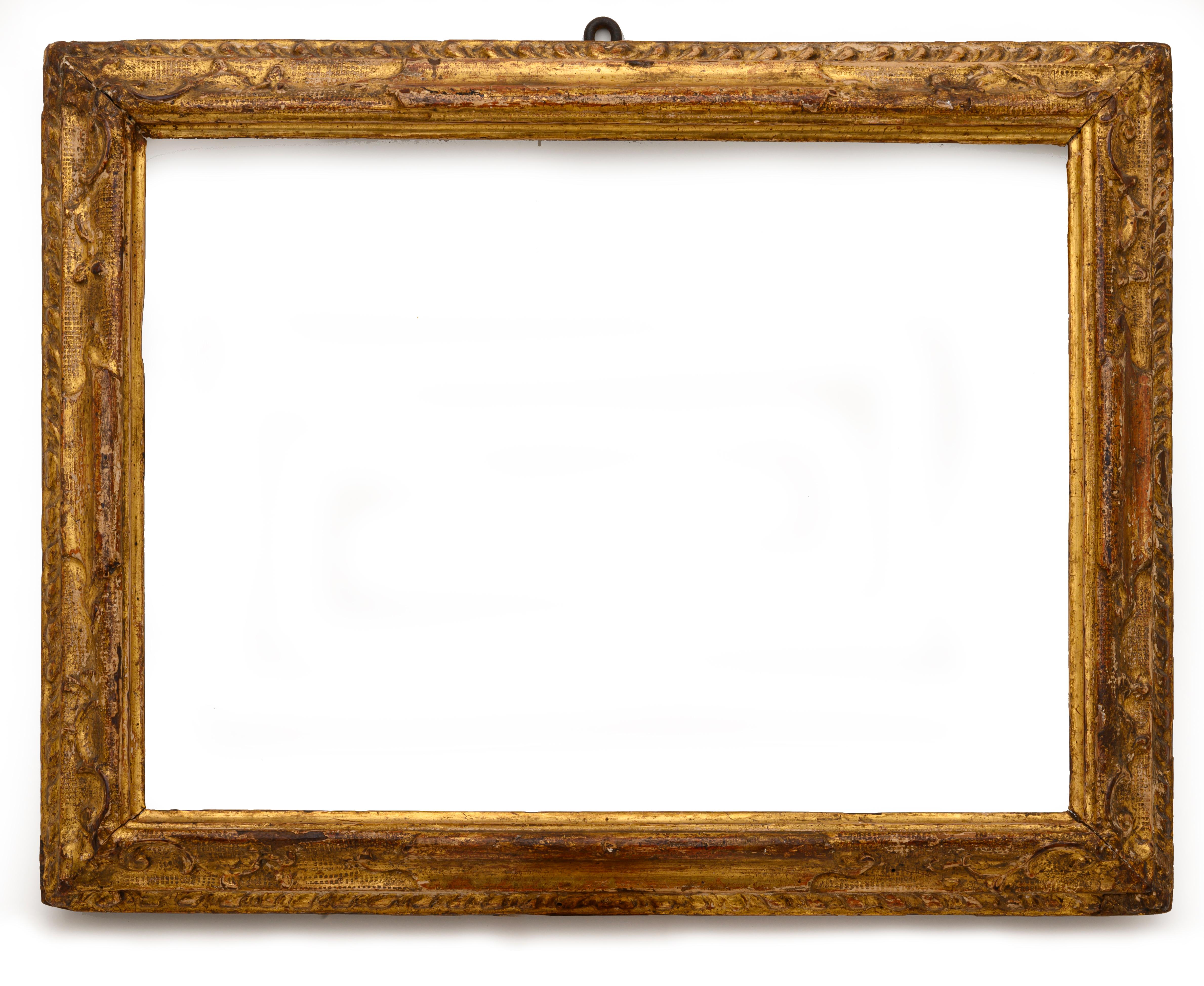 18th century Italian giltwood Frame realized in fir with a lovely original gilding. Rectangular shape, could be hanged horizontally or vertically. Beautiful hand-carving with scrolling motif and bulino engraving. Italy, 18th century. 
Good age