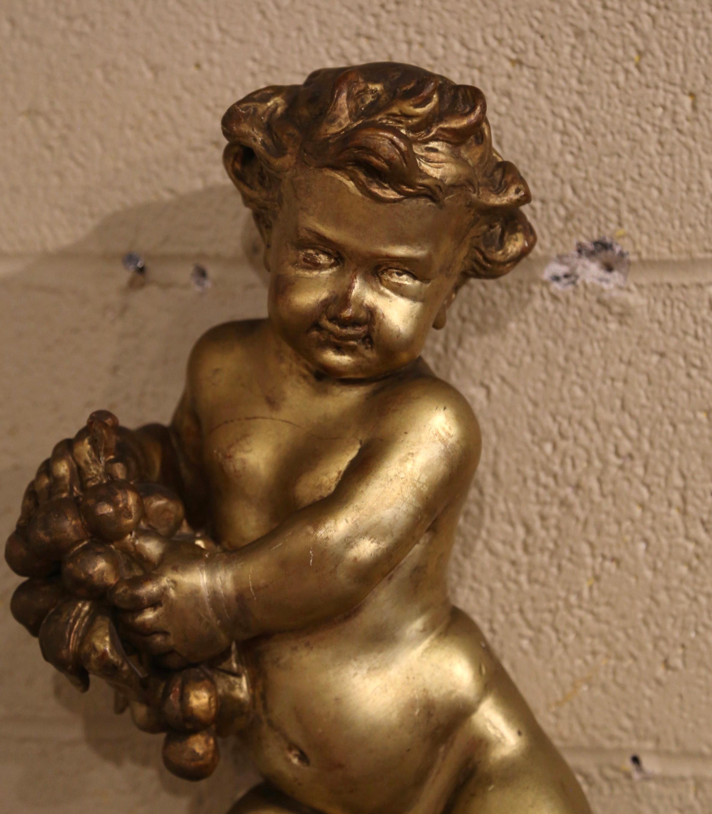 Hand-Carved 18th Century Italian Carved Giltwood Putti Cherub Wall Sculpture Holding Grapes For Sale