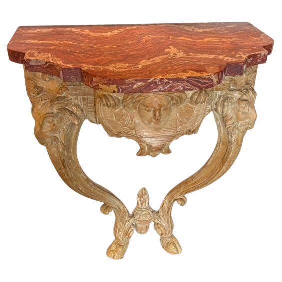 Tavolo da console con testa di ariete intagliata del XVIII secolo con piano in scagliola in vendita