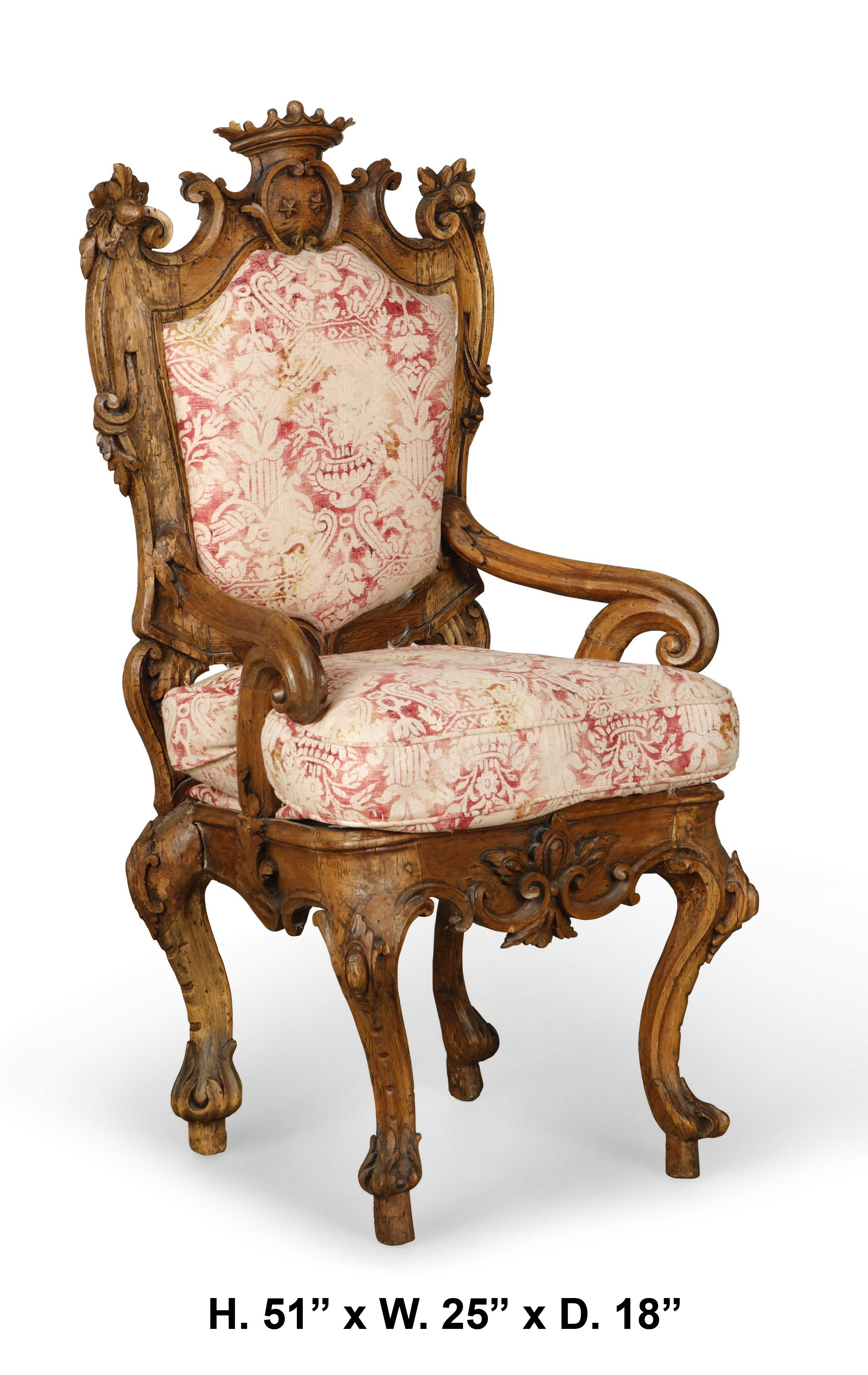 Impressive 18th century Italian hand carved walnut armchair with crown.

The armchair is with a shaped and arched padded back, beautifully scrolled arms, the scrolling crest rail is centered double C-scroll and surmounted with a finely carved